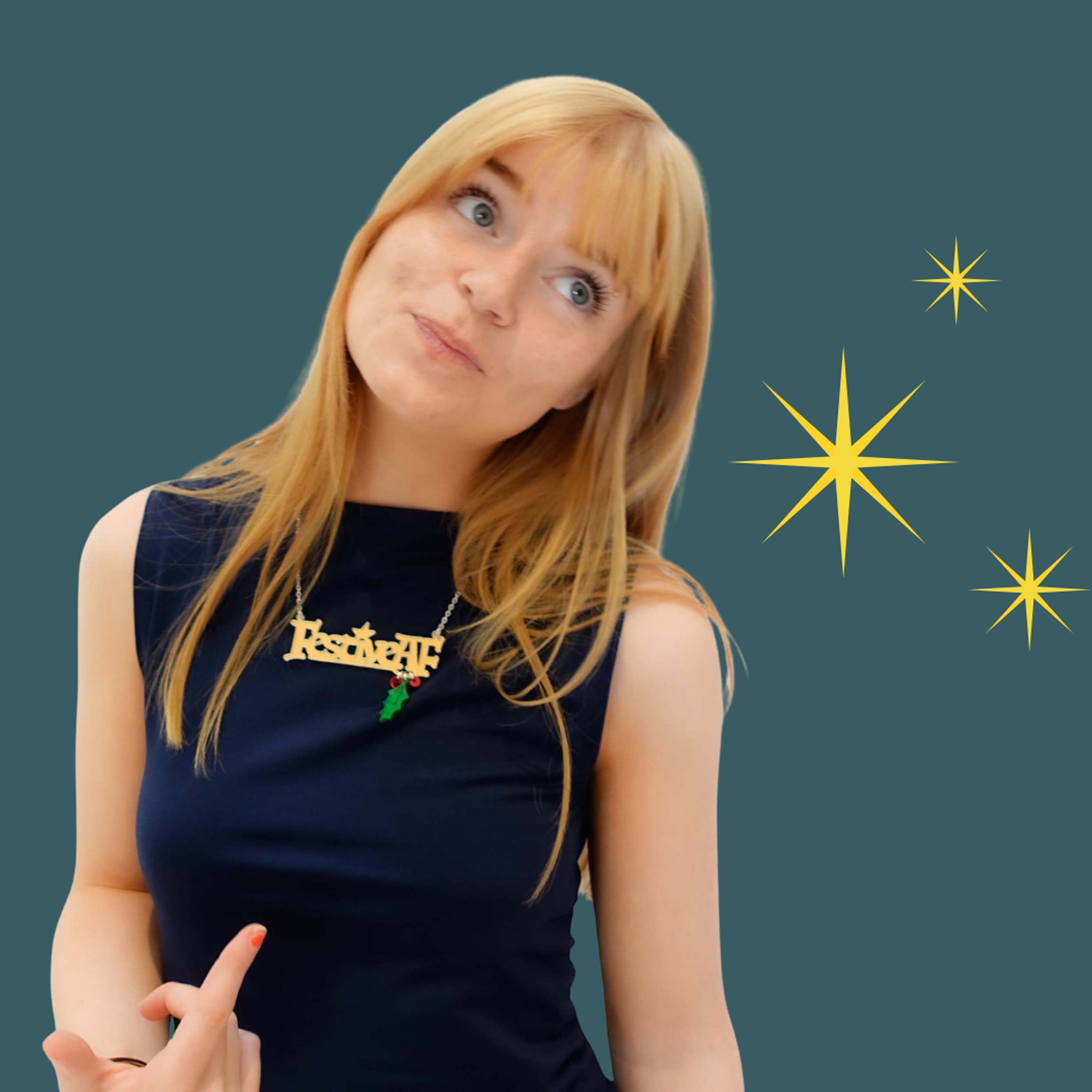 Eliza Day wears a Festive AF necklace in front of Christmassy stars