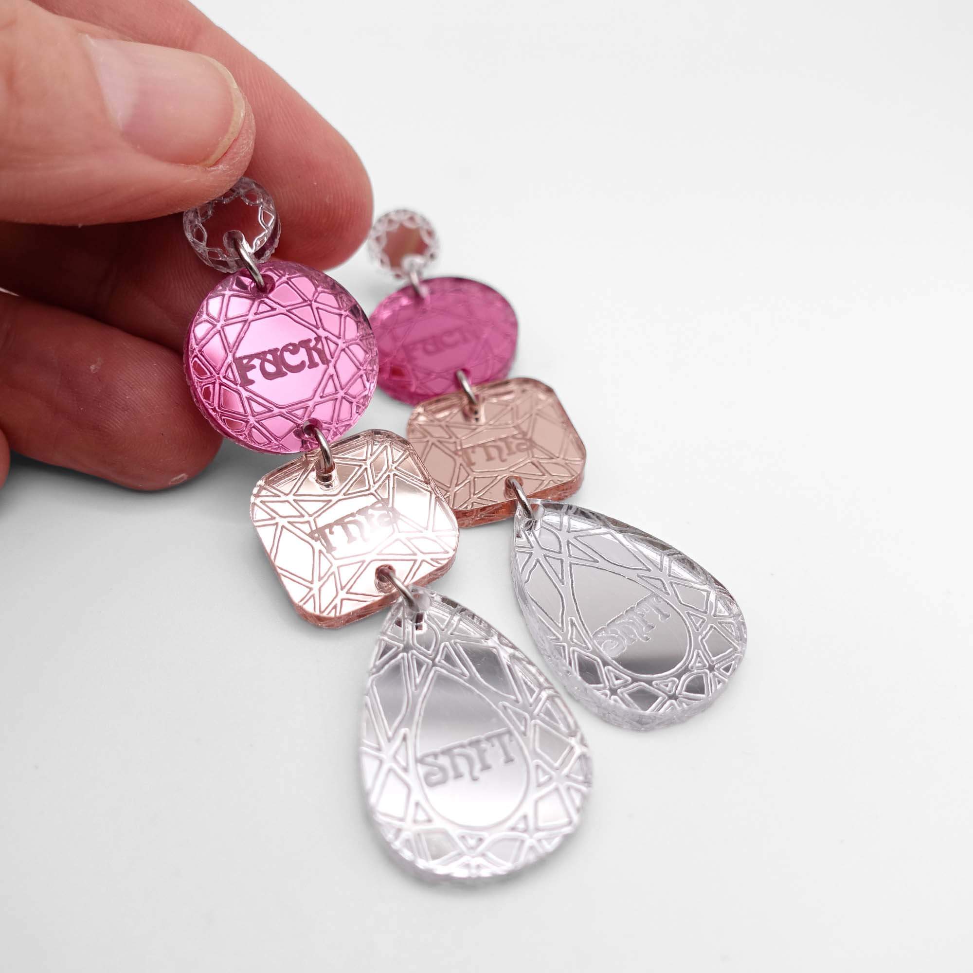 Eliza wears F*ck This Sh*t heart earrings designed by Sarah Day for Wear and Resist