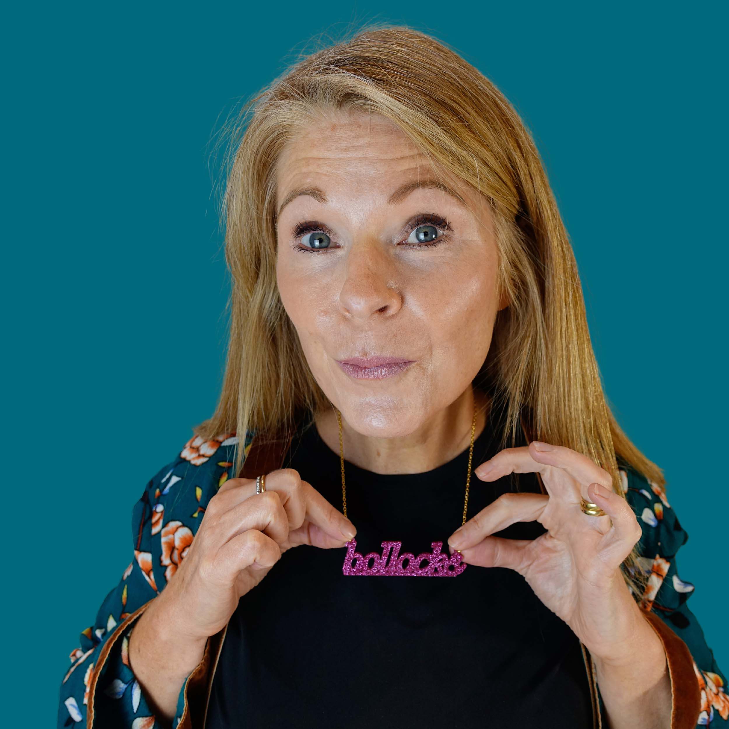 Sarah wears a Bollocks necklace in hot pink glitter.