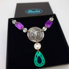 A close up of the Angel of Freedom necklace with the words Take Courage.