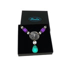 The Angel of Freedom necklace shown in a Wear and Resist gift box.