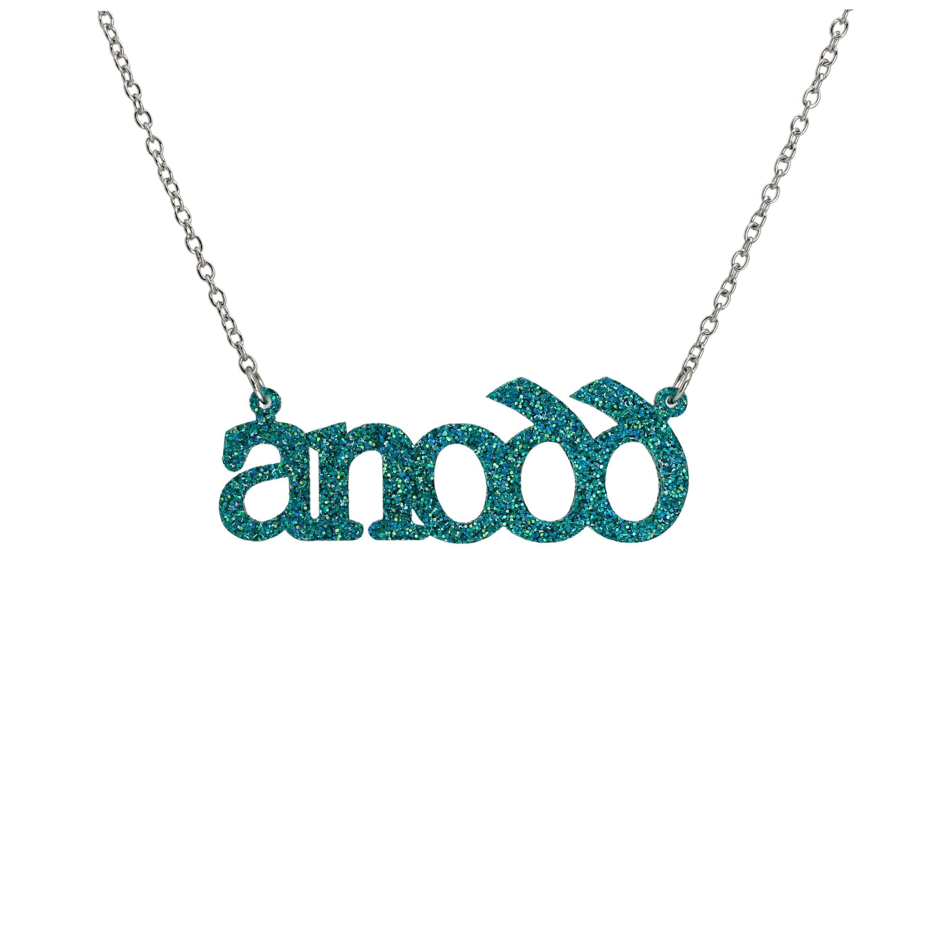 Anodd necklace for Welsh difficult women in bright teal glitter shown hanging on a stainless steel chain.