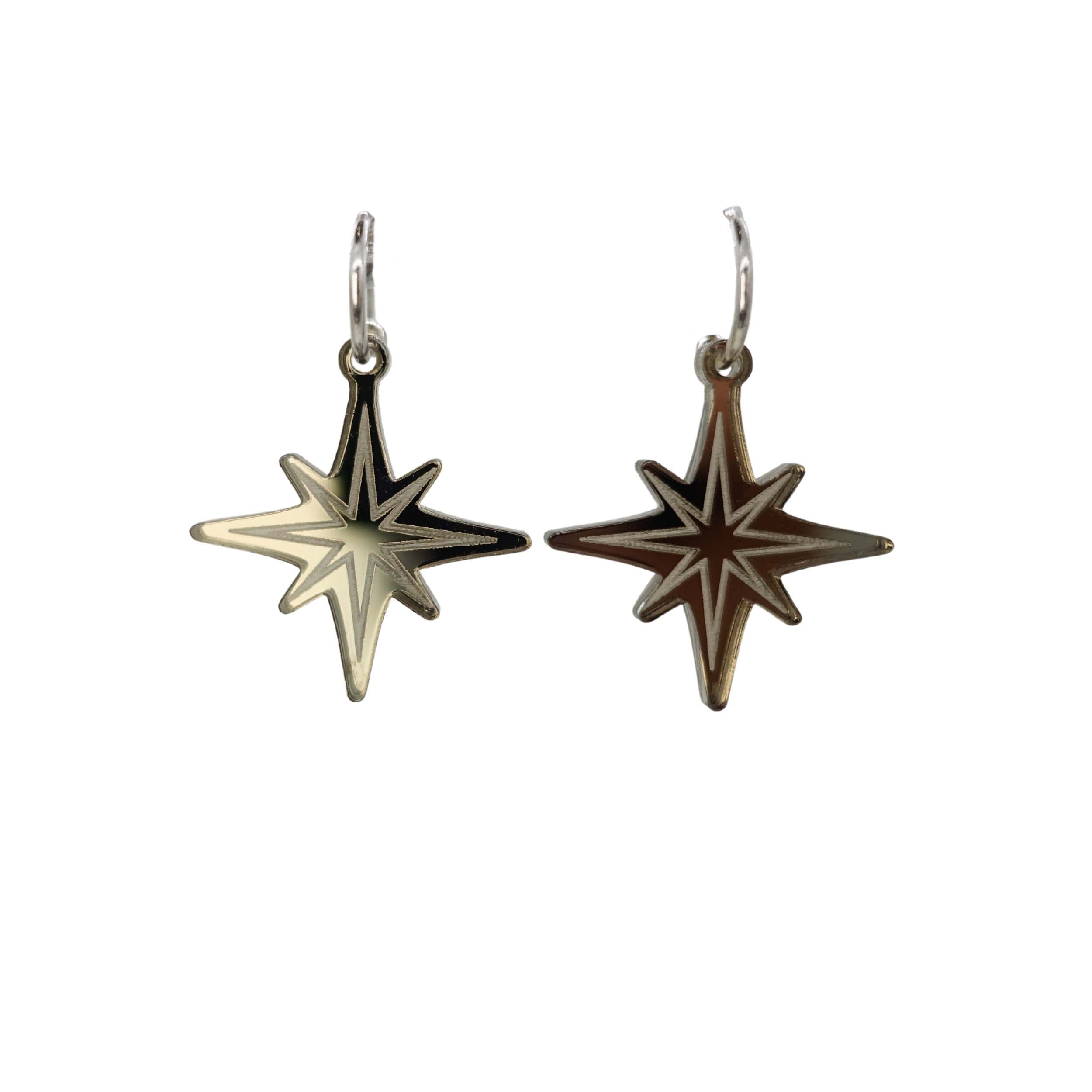 Etched vintage star earrings in bronze mirror from the Bronte Collection. Shown hanging against a white background.