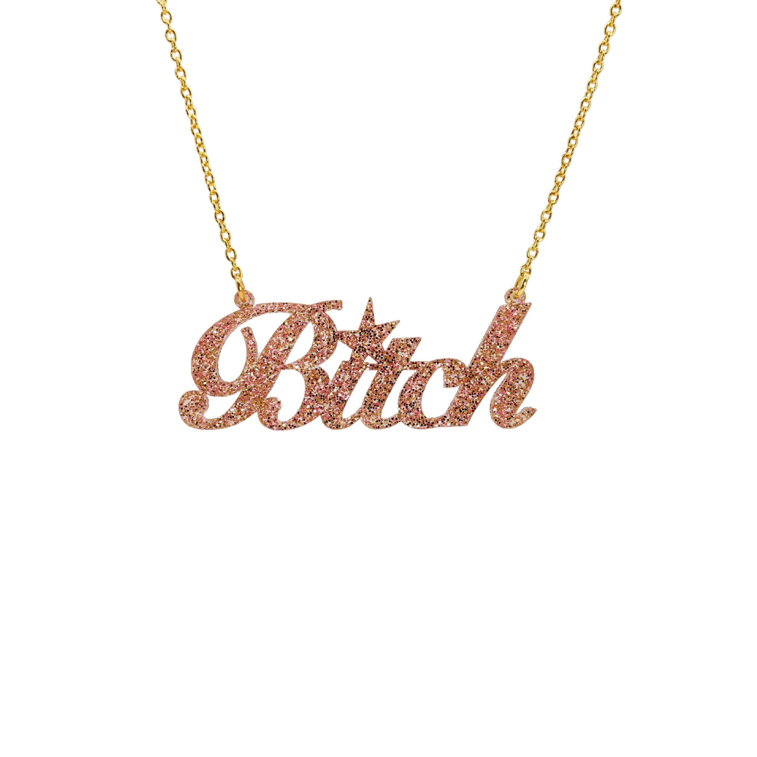 B*tch necklace in pink fizz glitter shown hanging against a white background. £2 goes to Bloody Good Period.