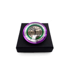 A round brooch etched with the words You have to be militant in  your own way, from Emmeline Pankhurst's famous quote. The centre is a bronze etched Angel of Freedom by Sylvia Pankhurst with stars and the bands surrounding it are in the Suffragette colours.