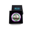 Round brooch etched with You have to be militant in your own way and Take Courage in the Suffragette colours, shown in a Wear and Resist gift box.