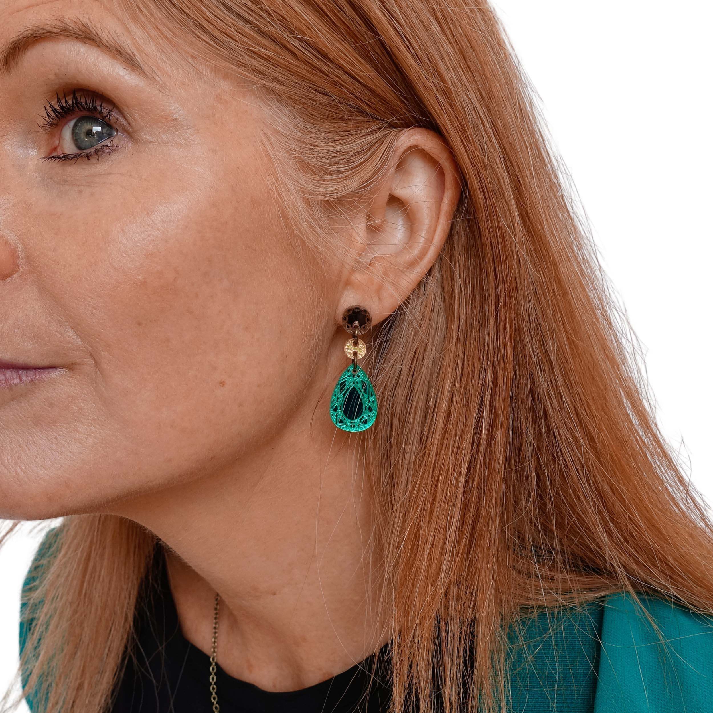 Sarah wears electric green Belle Epoque French drop earrings. 