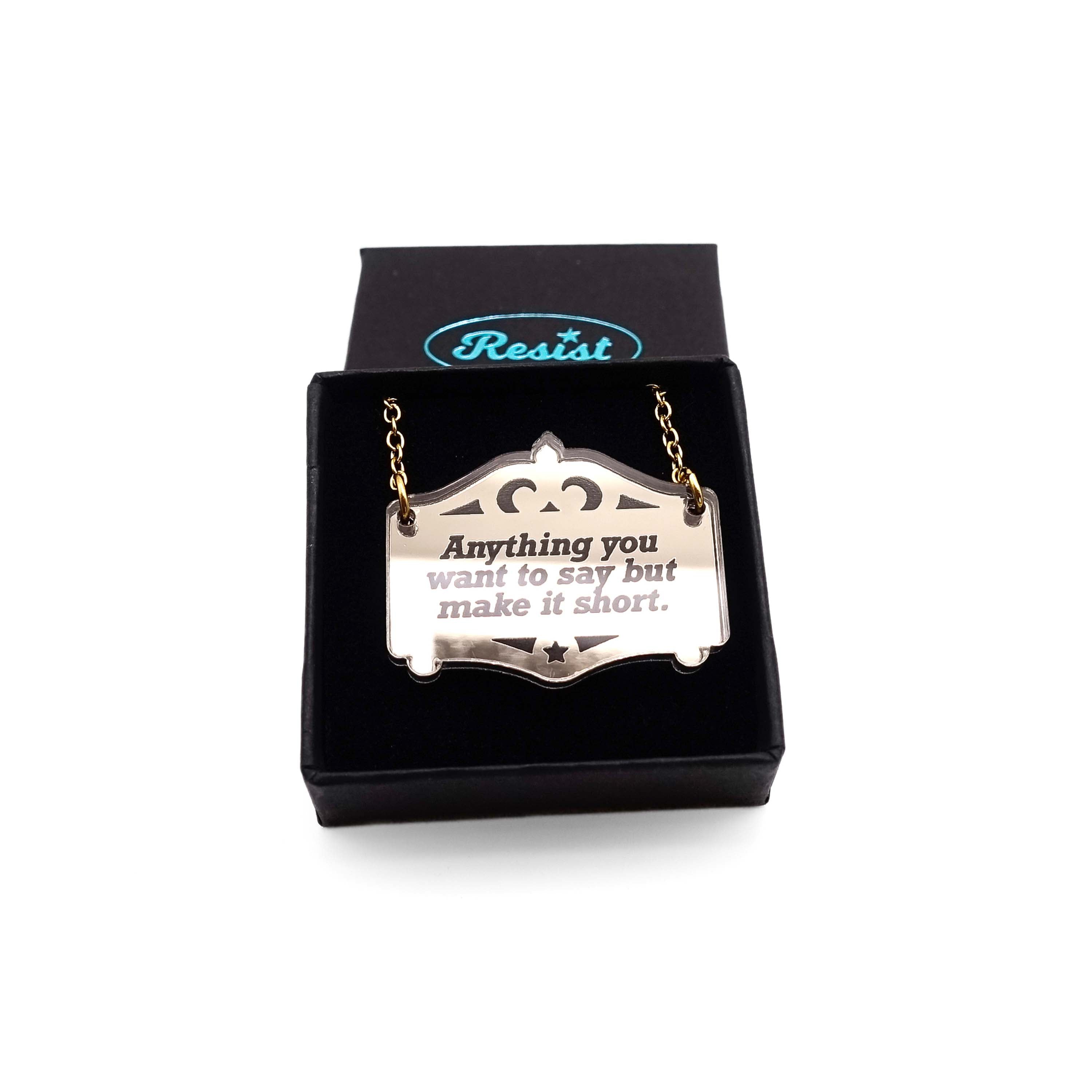 Any words you want on a bespoke bronze Mirror Cowboy necklace, shown in a small Wear and Resist gift box.