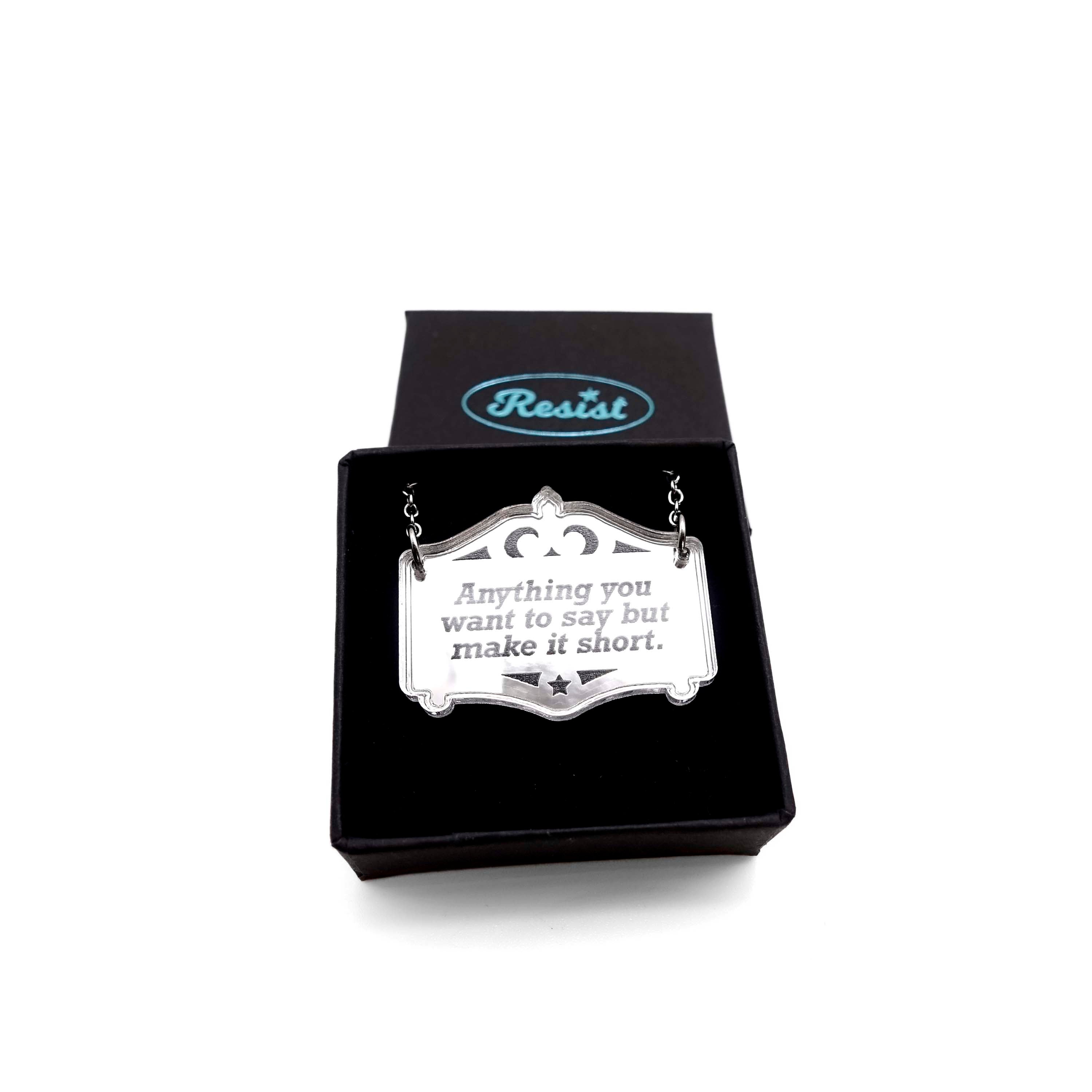 Any words you want on a bespoke silver Mirror Cowboy necklace, shown in a small Wear and Resist gift box.