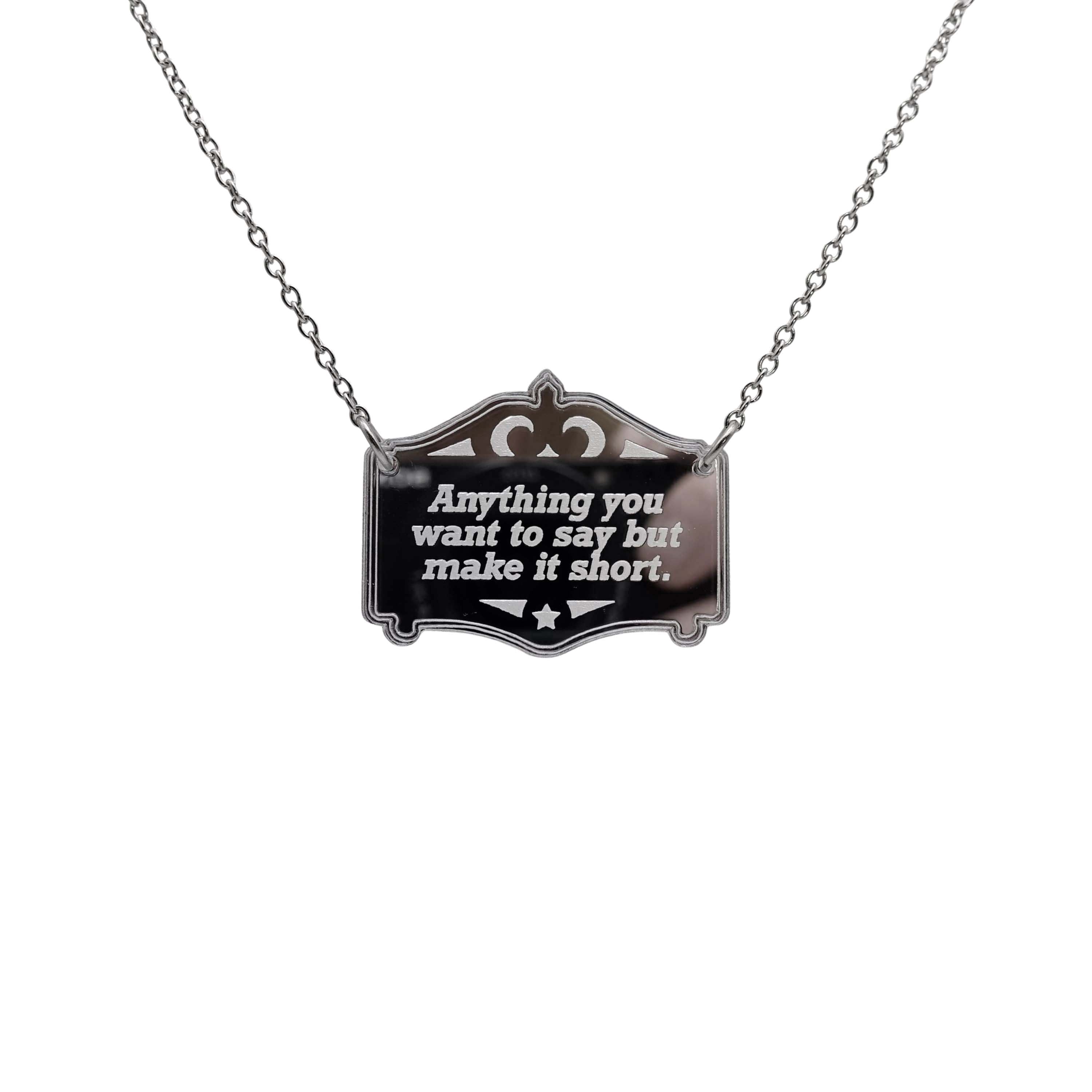 Any words you want on a bespoke silver Mirror Cowboy necklace, shown hanging on a stainless steel chain.