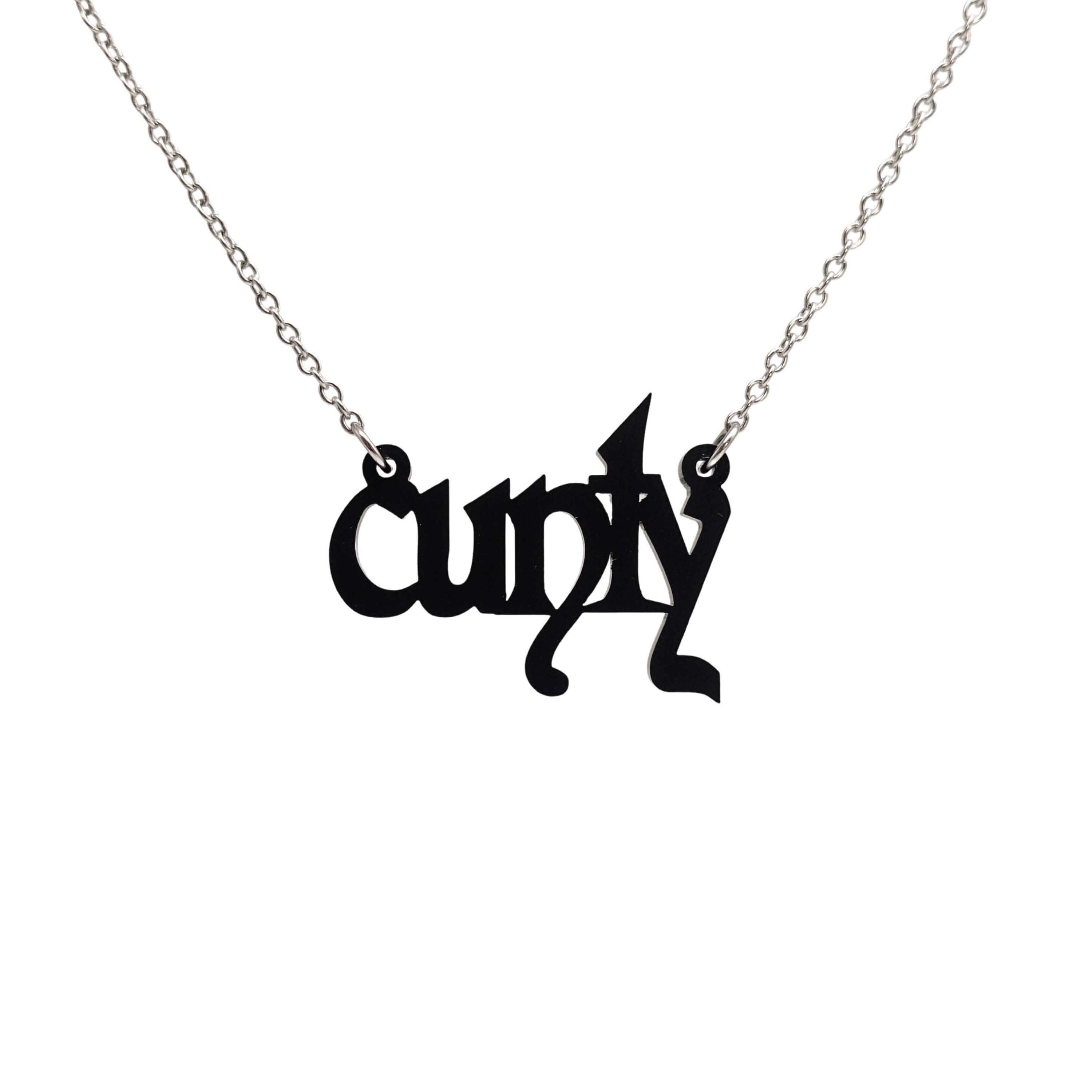 Little CUNTY necklace in matte black shown hanging on a stainless steel chain.
