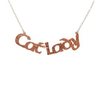 Cat Lady necklace in pink fizz glitter, shown hanging against a white background.