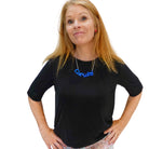 Sarah Day wears a Cat Lady necklace in blue. An insult I'm proud to own.