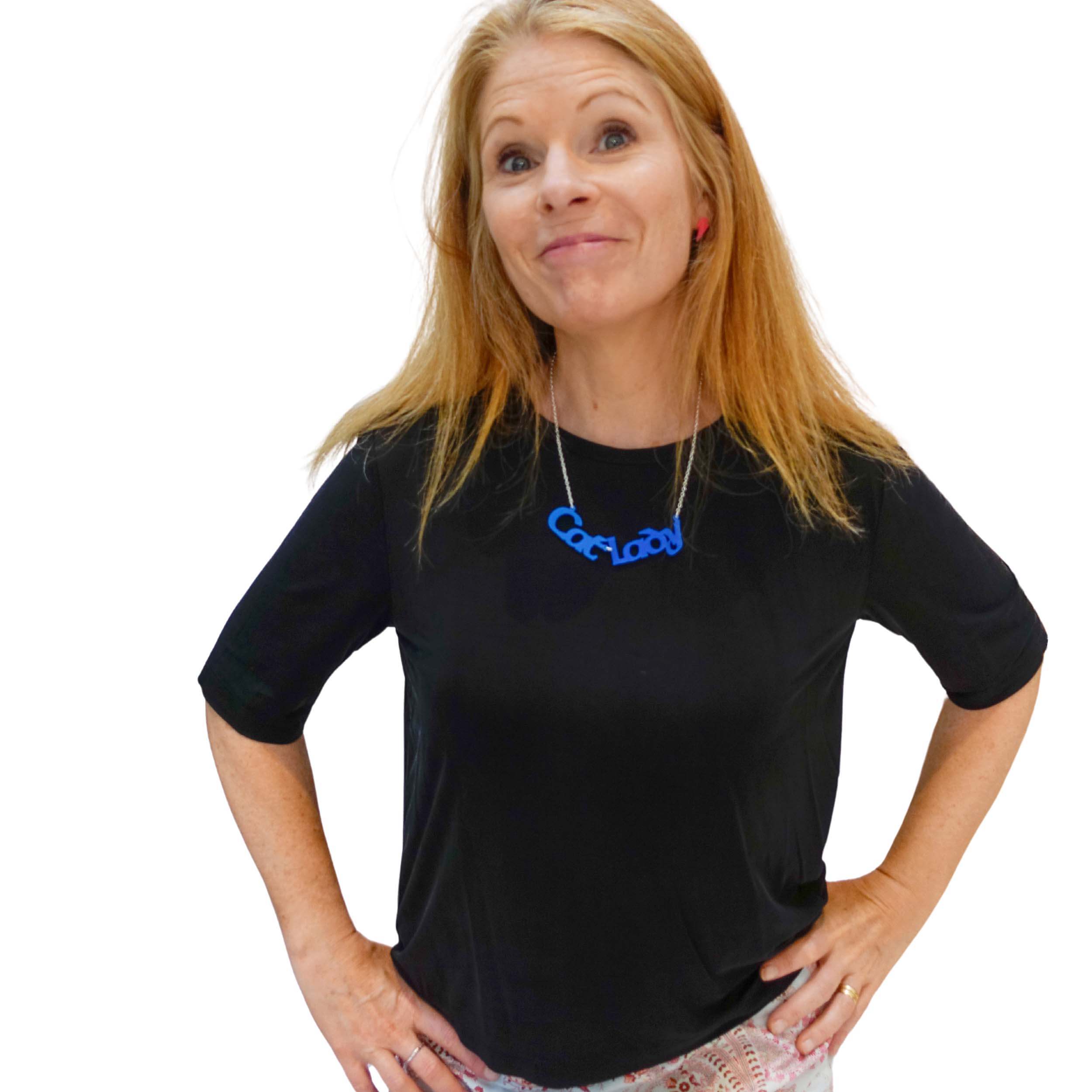 Sarah Day wears a Cat Lady necklace in blue. An insult I'm proud to own.