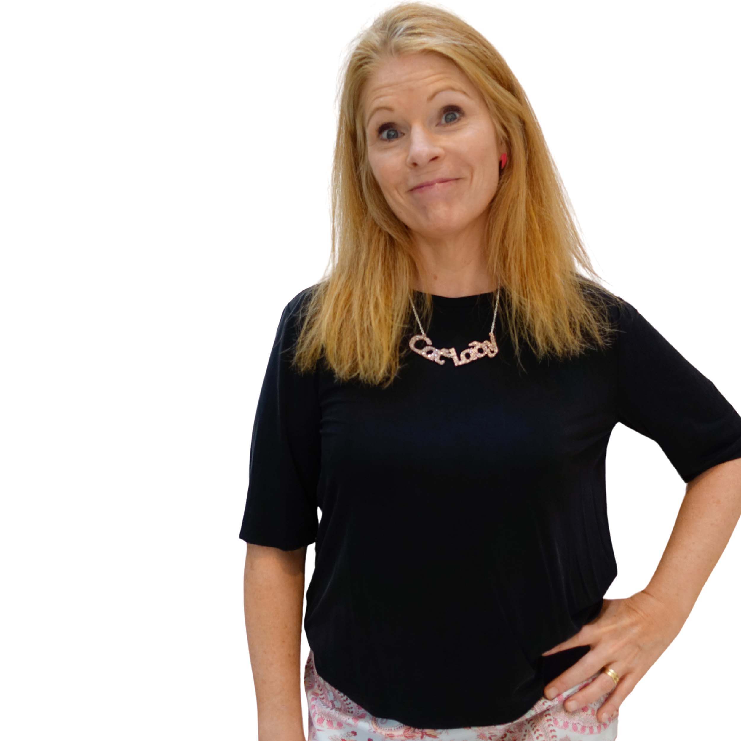 Sarah Day, founder of Wear and Resist wears a pink fizz glitter Cat Lady necklace.