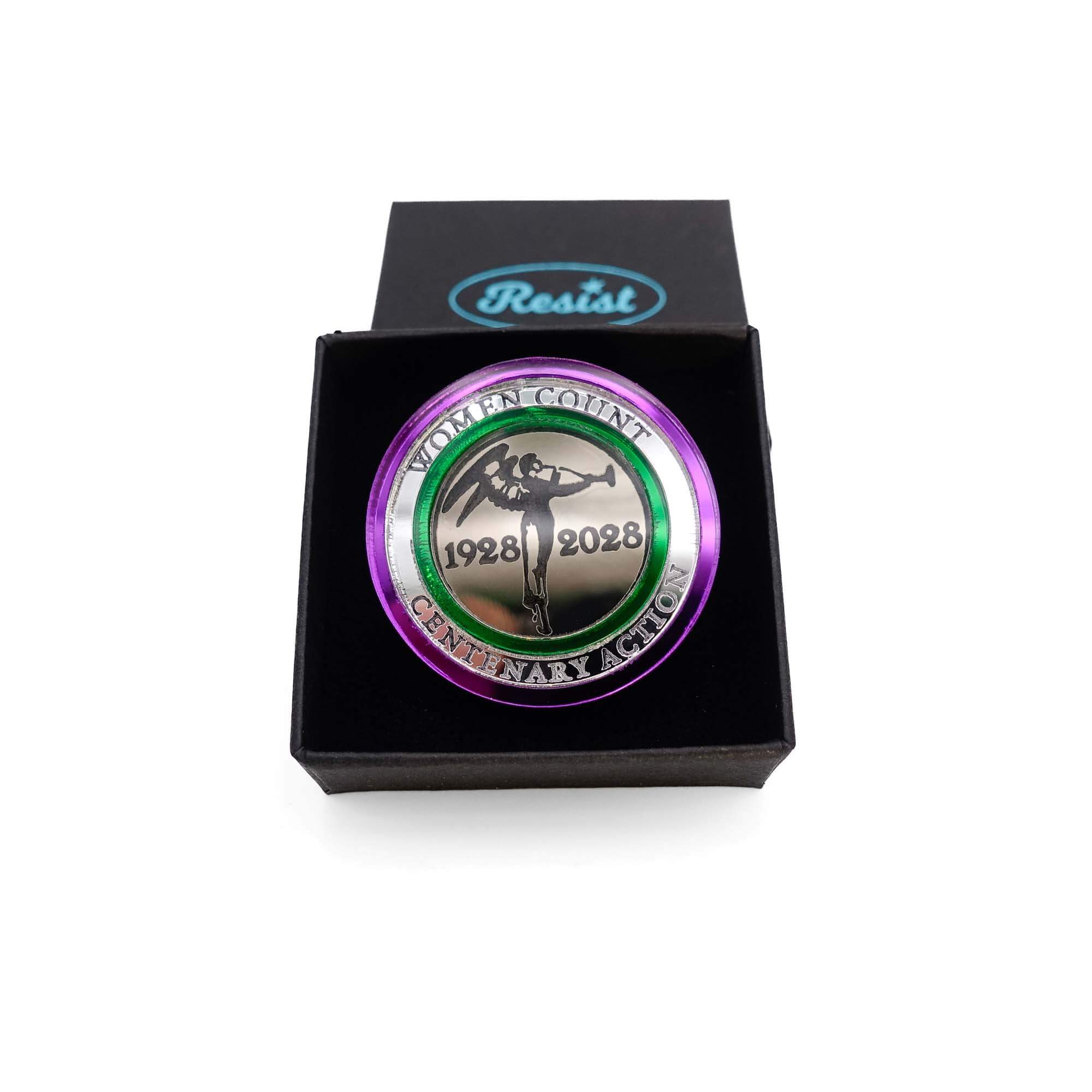 Centenary Action round brooch shown in a Wear and Resist gift box.