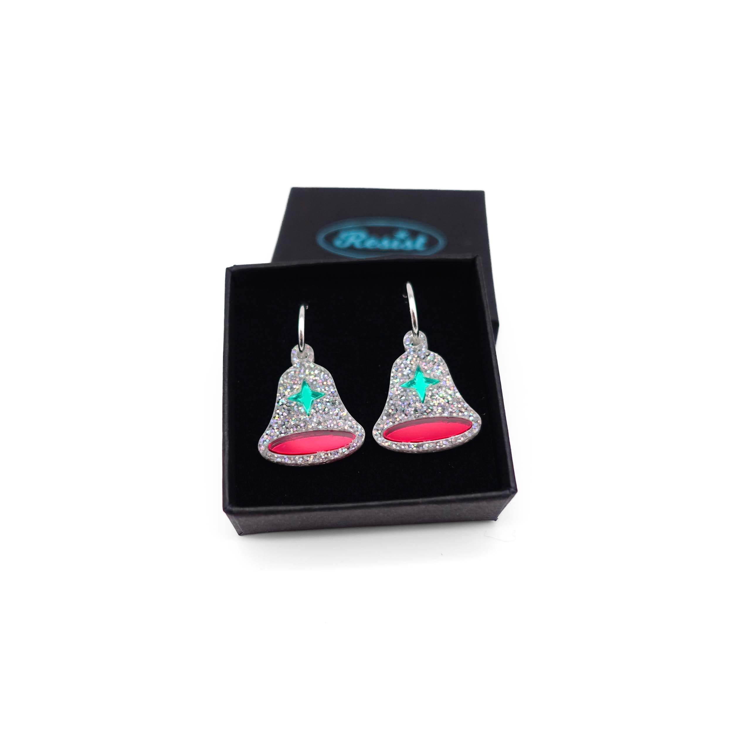 Silver glitter bell earrings, shown in a Wear and Resist gift box.