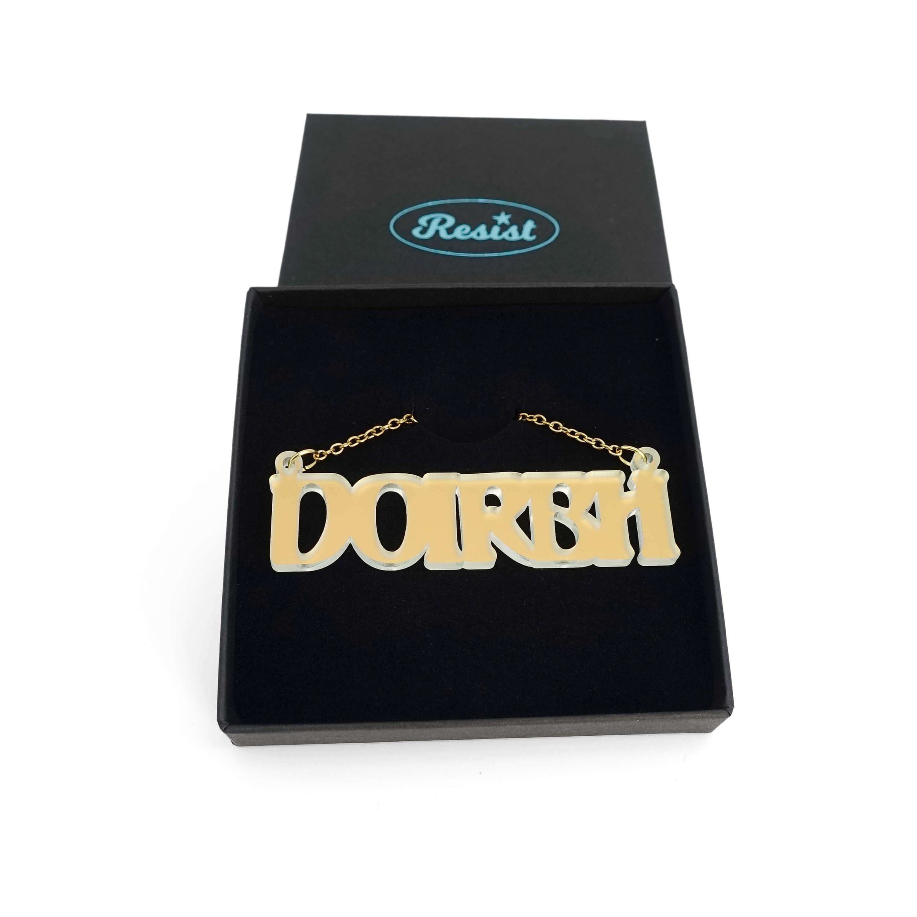 DOIRBH Gaelige necklace for Irish difficult women in matte iridescent, shown in a Wear & Resist gift box.