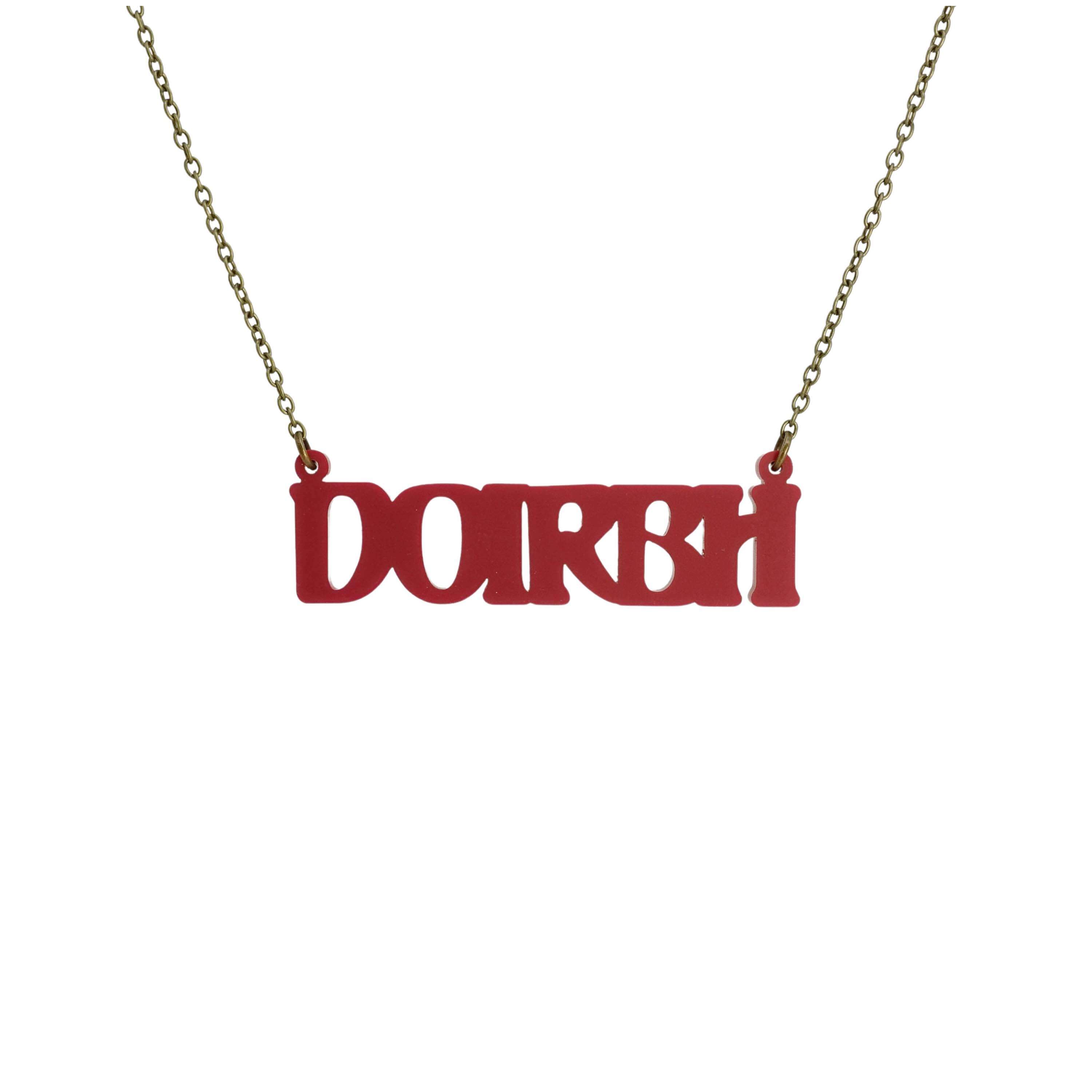 DOIRBH Gaelige necklace for Irish difficult women in oxblood red, shown hanging on an antique gold chain.