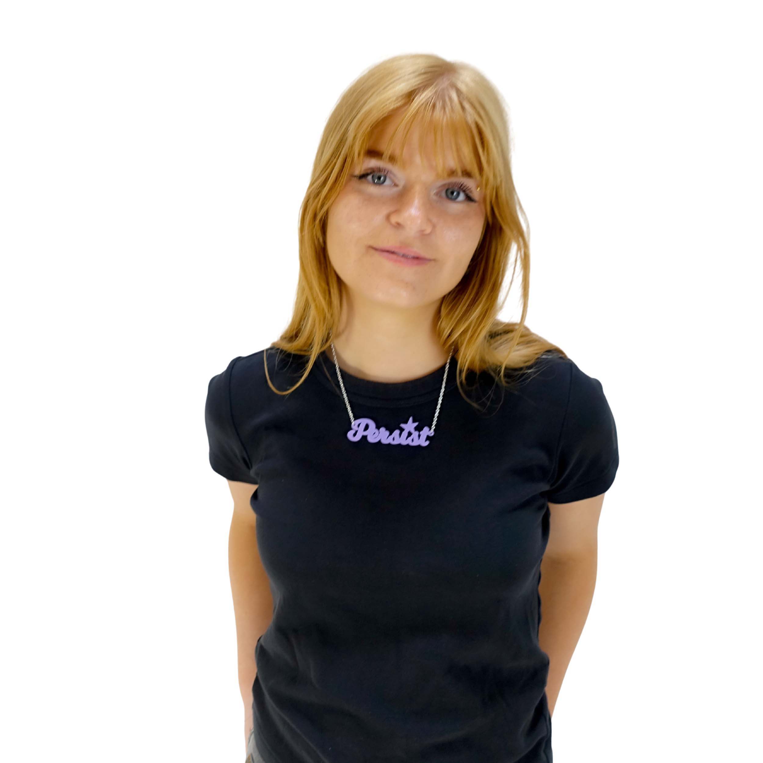 Eliza wears a parma violet Persist necklace.