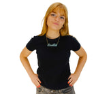 Eliza wears a Bookish necklace in duck egg green.