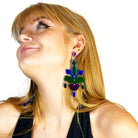 Eliza wears midnight Festive Drop statement earrings.