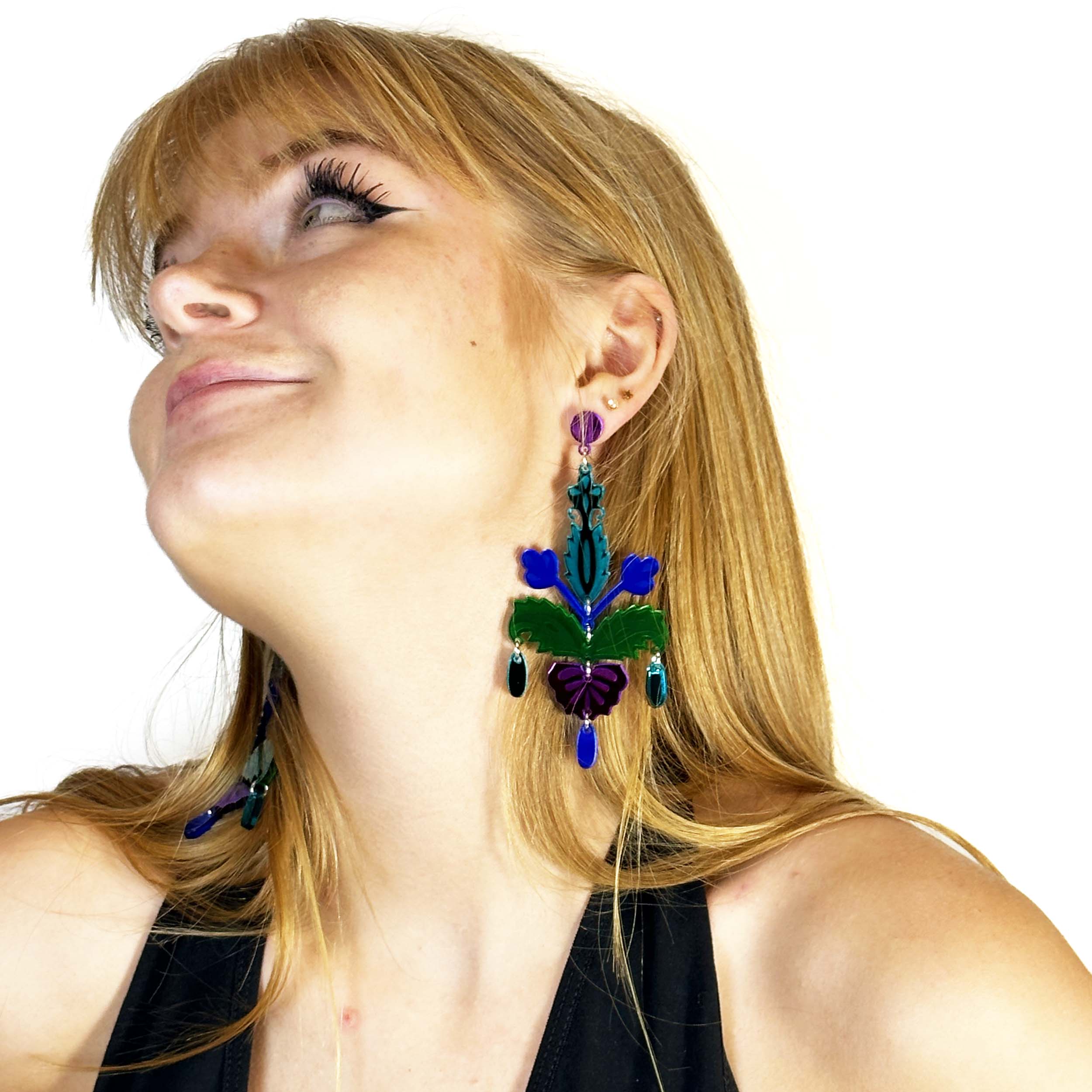 Eliza wears midnight Festive Drop statement earrings.