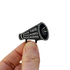 F*ck these F*cking F*ckers Megaphone brooch, shown held up in my fingers for size reference.