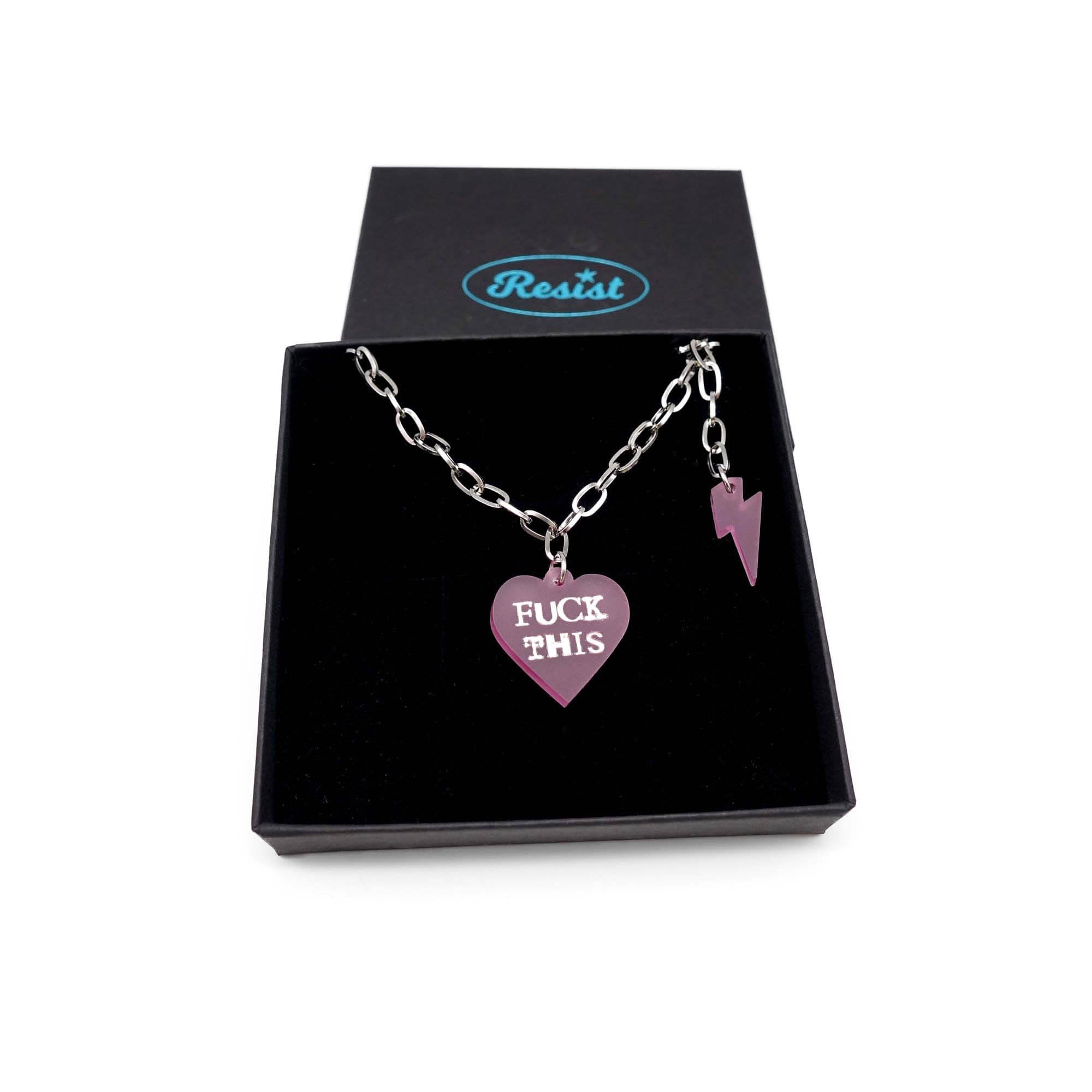 F*ck This punk necklace in pale pink frost with matching lightning bolt shown in a Wear and Resist gift box.