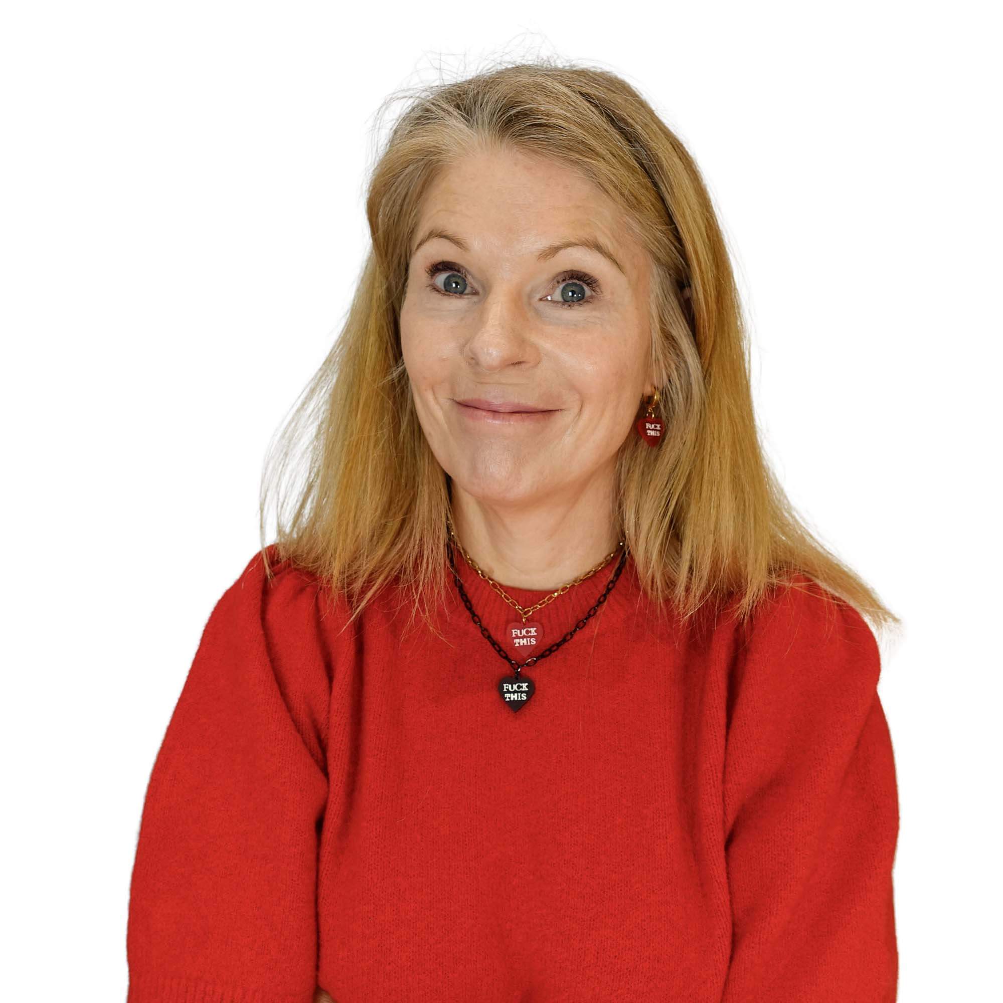 Sarah wears F*ck This punk chain necklaces in red and slate.