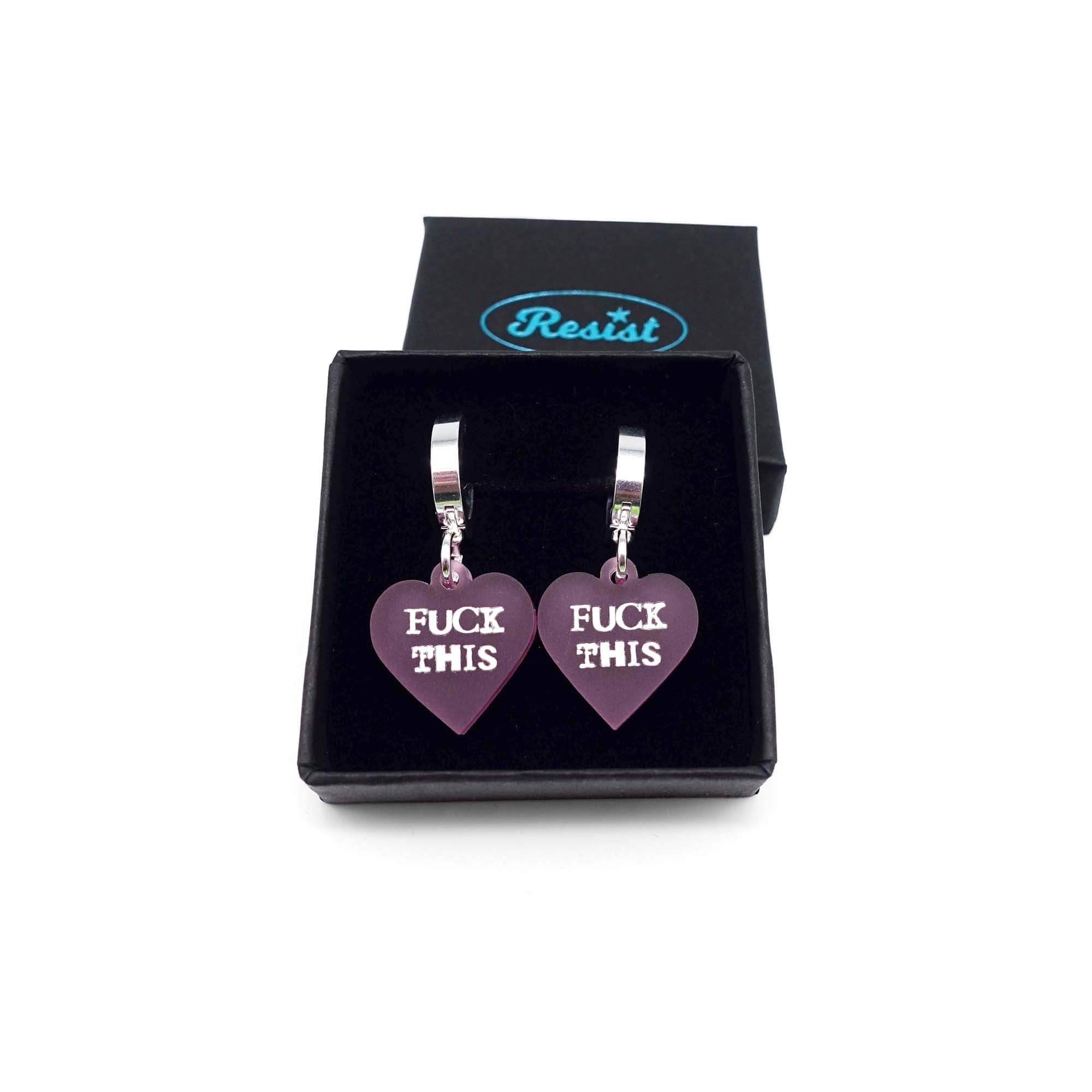 Pale pink frost F*ck This huggie hoop earrings shown in a small Wear and Resist gift box.