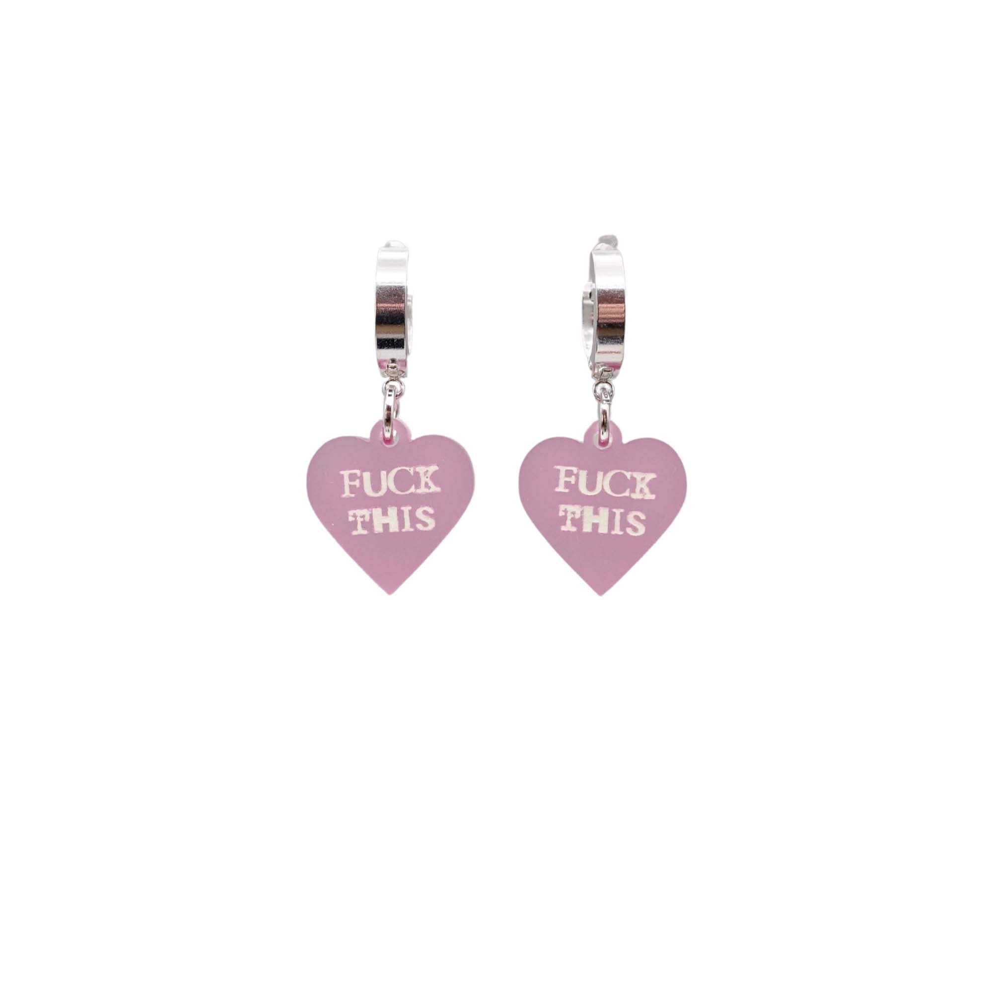 Pale pink frost F*ck This huggie hoop earrings etched with glow-in-the-dark pigment. Sweary hearts!