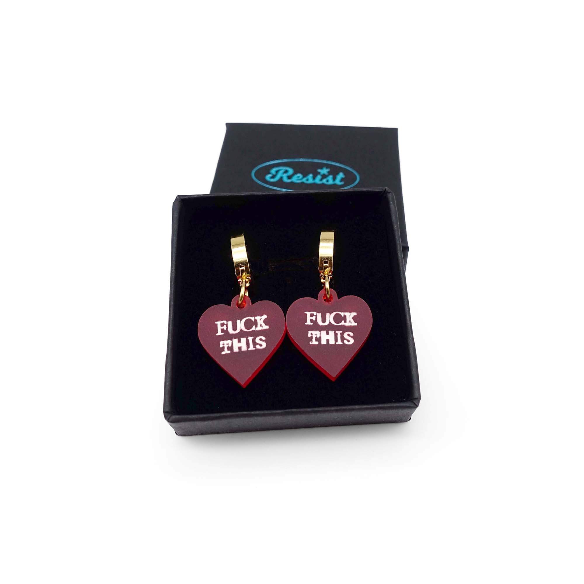 Chilli red frost F*ck This huggie hoop earrings shown in a small Wear and Resist gift box.