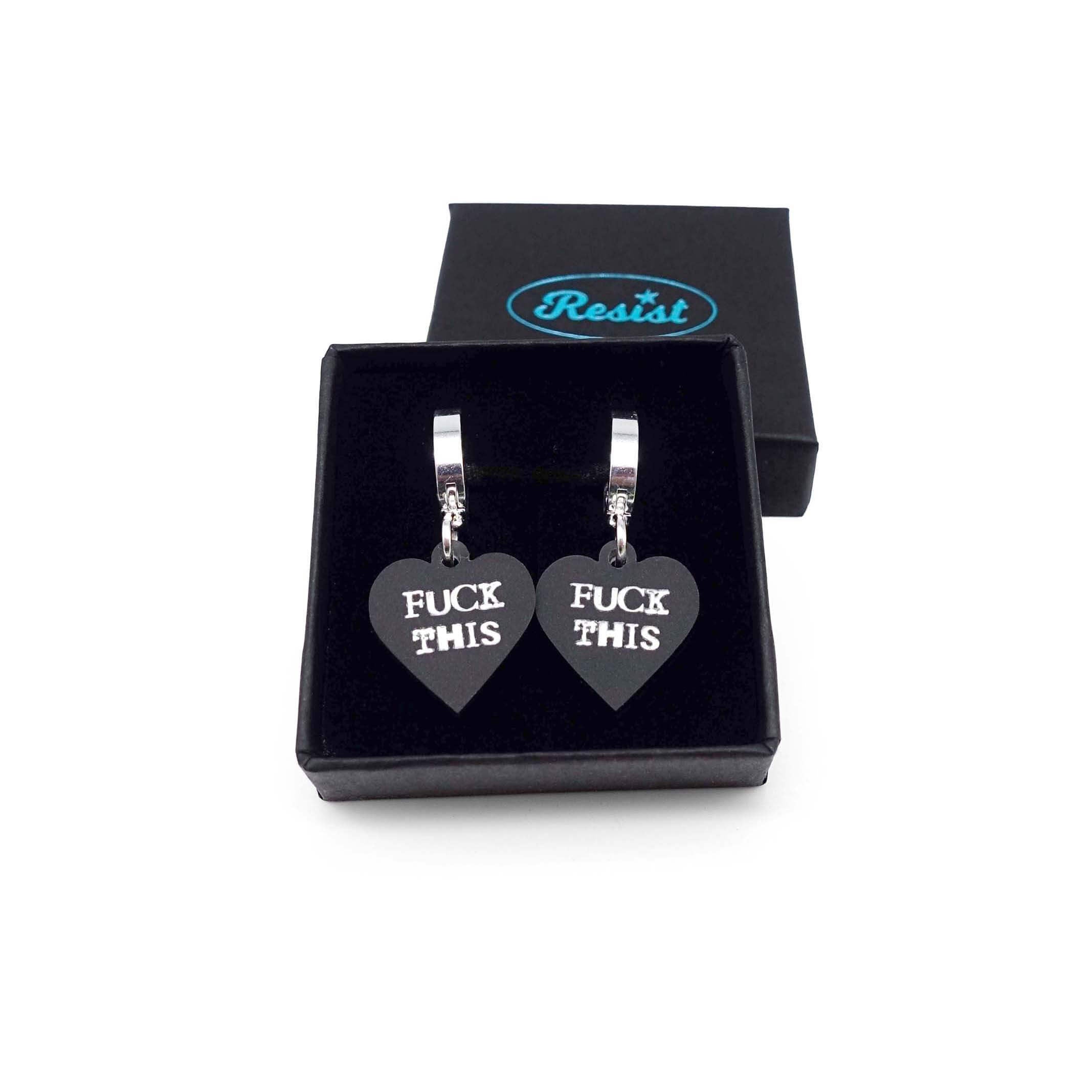 Slate frost F*ck This huggie hoop earrings shown in a small Wear and Resist gift box.
