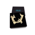 F*ck Yeah necklace in matte iridescent, shown in a Wear and Resist gift box.