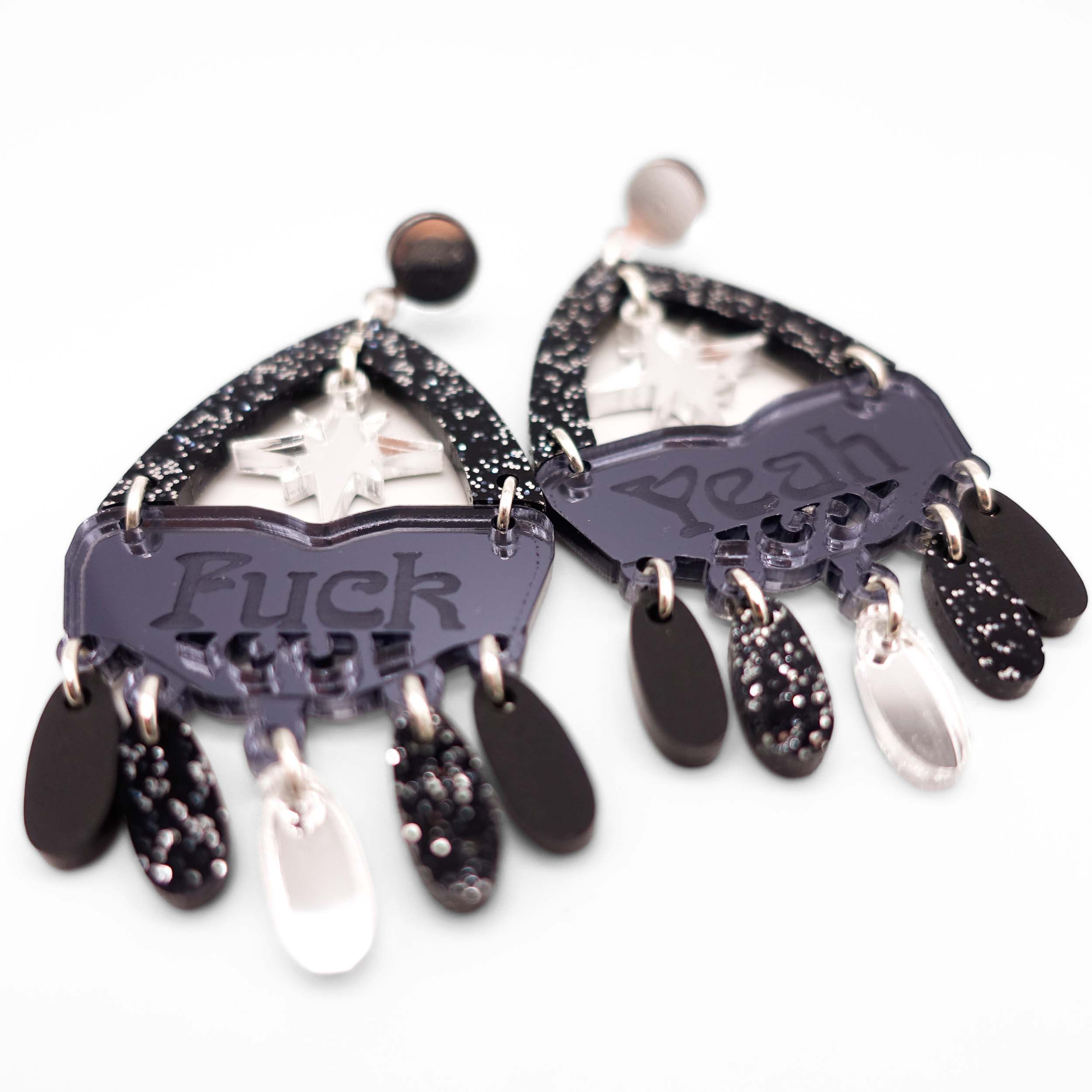 A close up of the F*ck Yeah statement earrings in midnight colourway.
