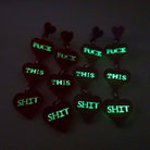 F*ck this Sh*t earrings glowing in the dark. £2 goes to Bloody Good Period.