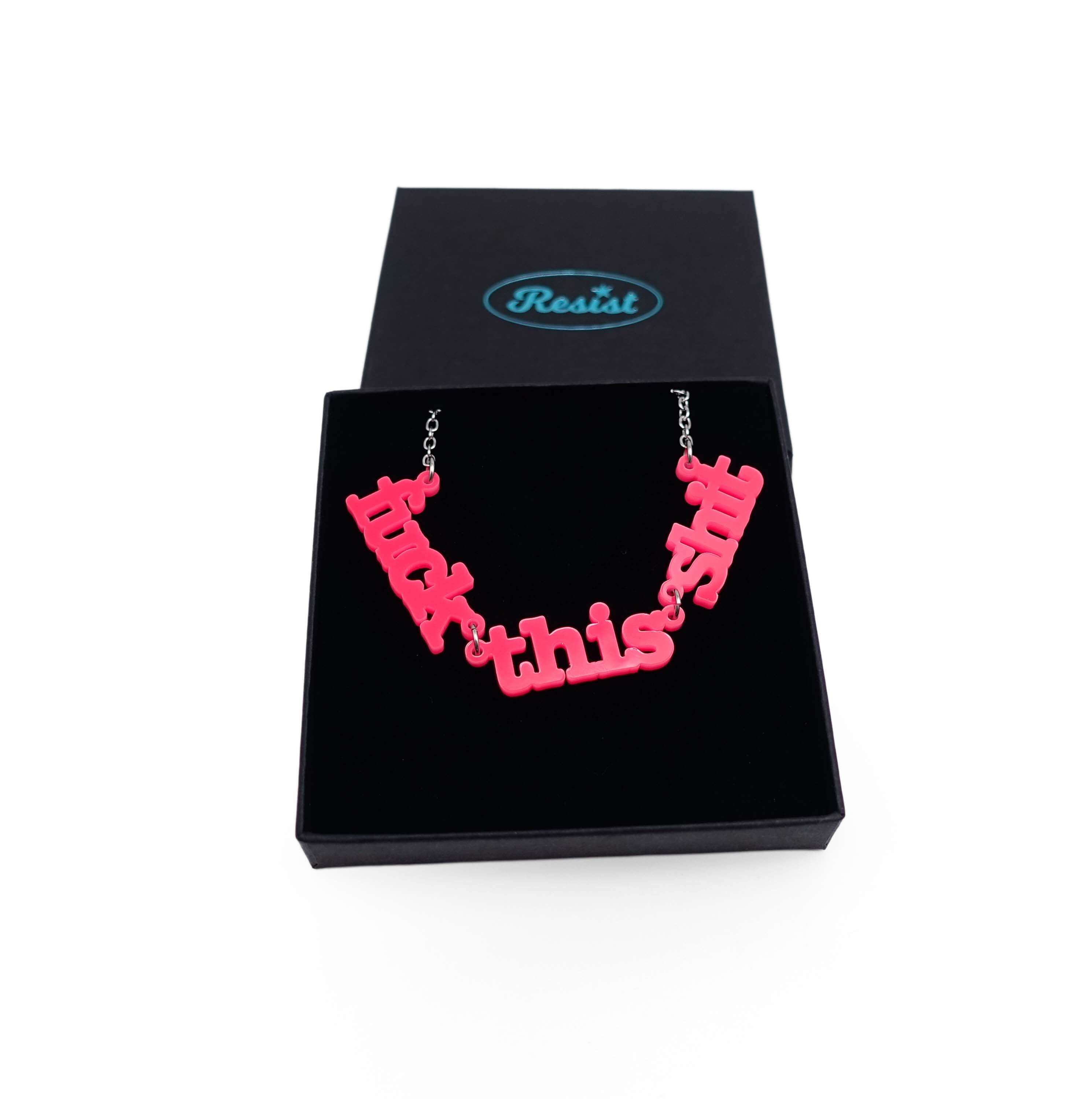 F*ck this Sh*t necklace in hot pink shown in a Wear and Resist gift box.