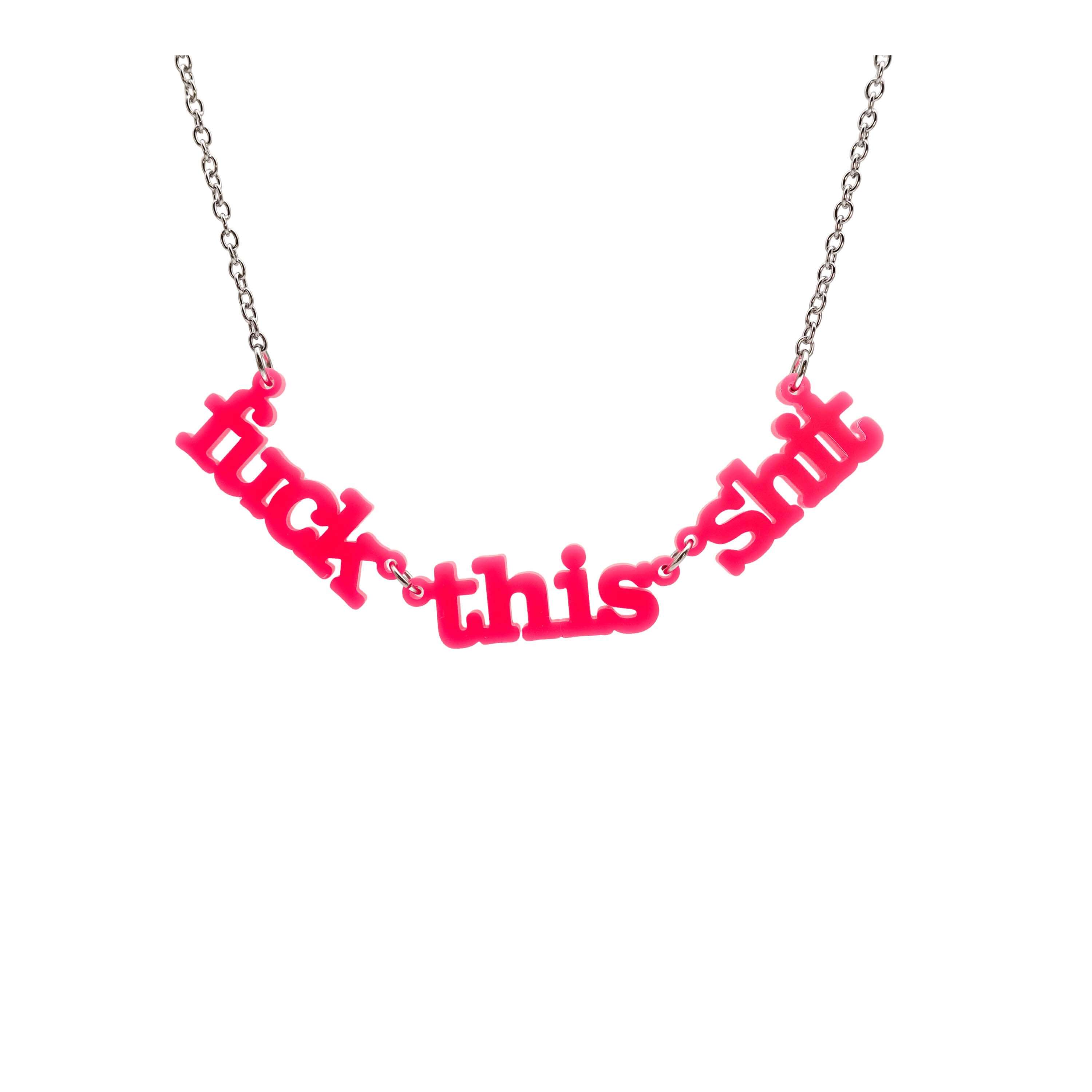 F*ck this Sh*t necklace in hot pink shown hanging on a stainless steel chain against a white background.