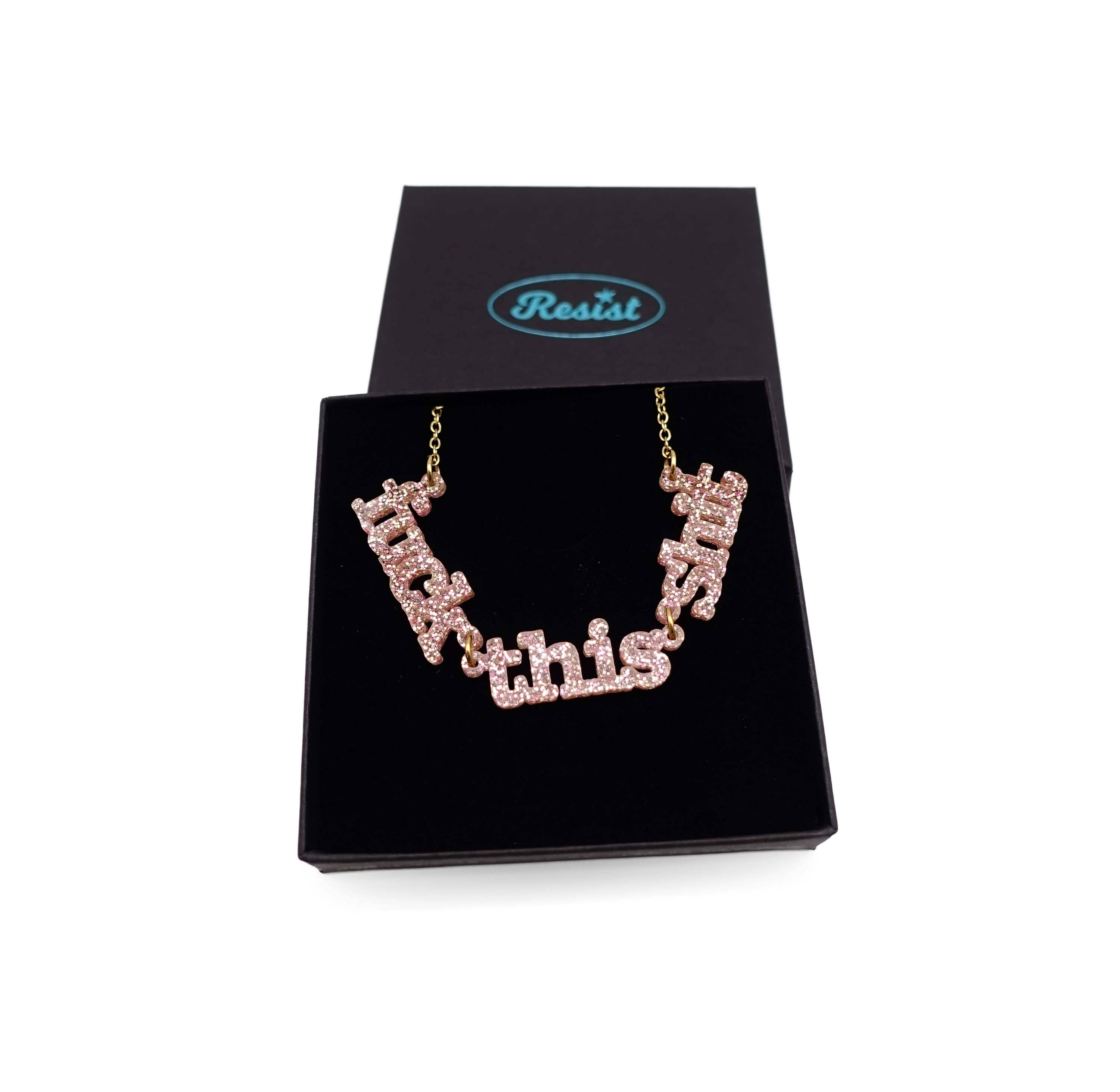 F*ck this Sh*t necklace in pink fizz glitter shown in a Wear and Resist gift box.