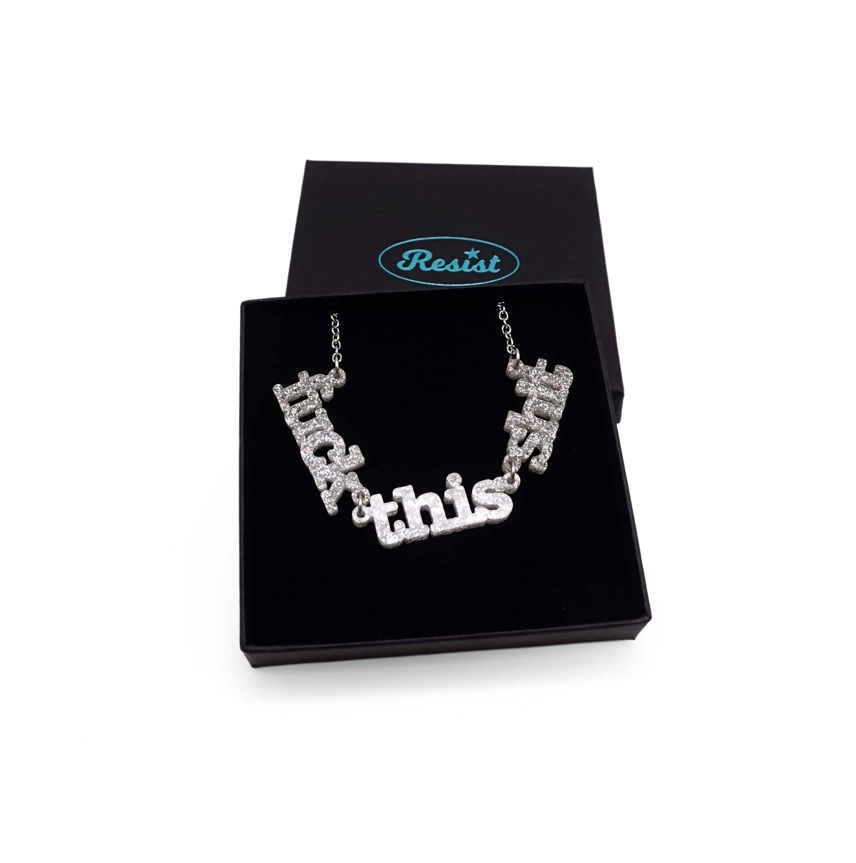 F*ck this Sh*t necklace in silver glitter shown in a Wear and Resist gift box.