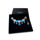 F*ck This Sh*t Jewel necklace in blue shown in a large Wear and Resist gift box.