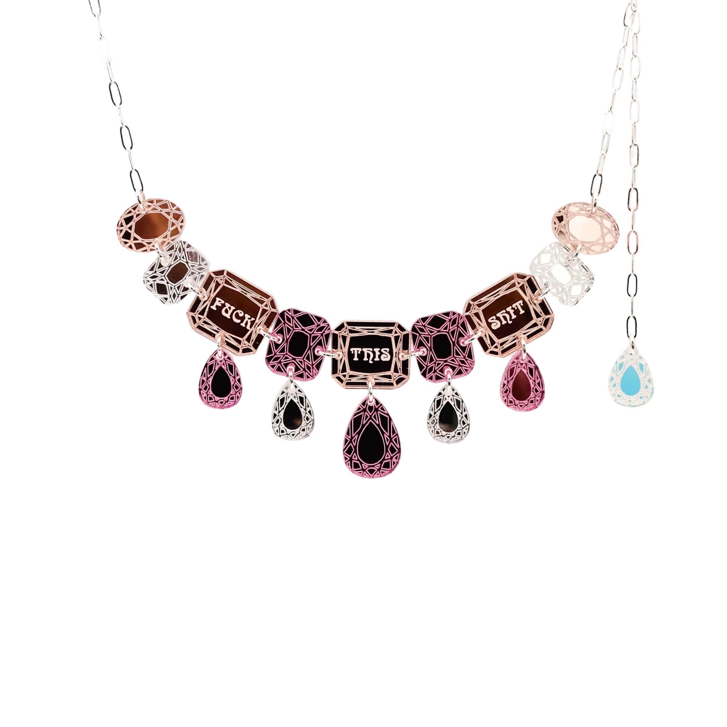 F*ck This Sh*t Jewel necklace in pink shown hanging against a white background.