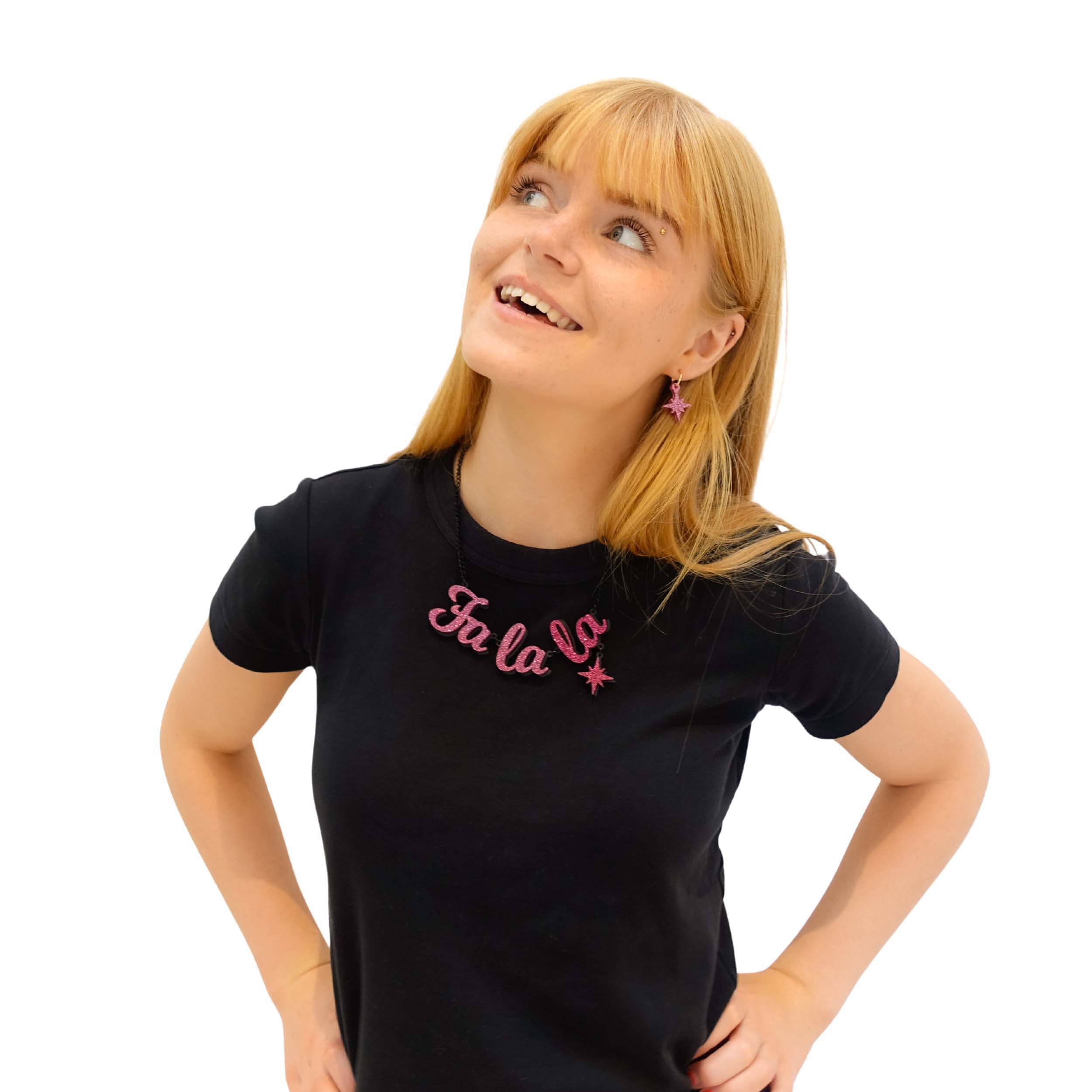 Eliza wears a Fa La LA necklace in hot pink glitter, with hanging vintage star.