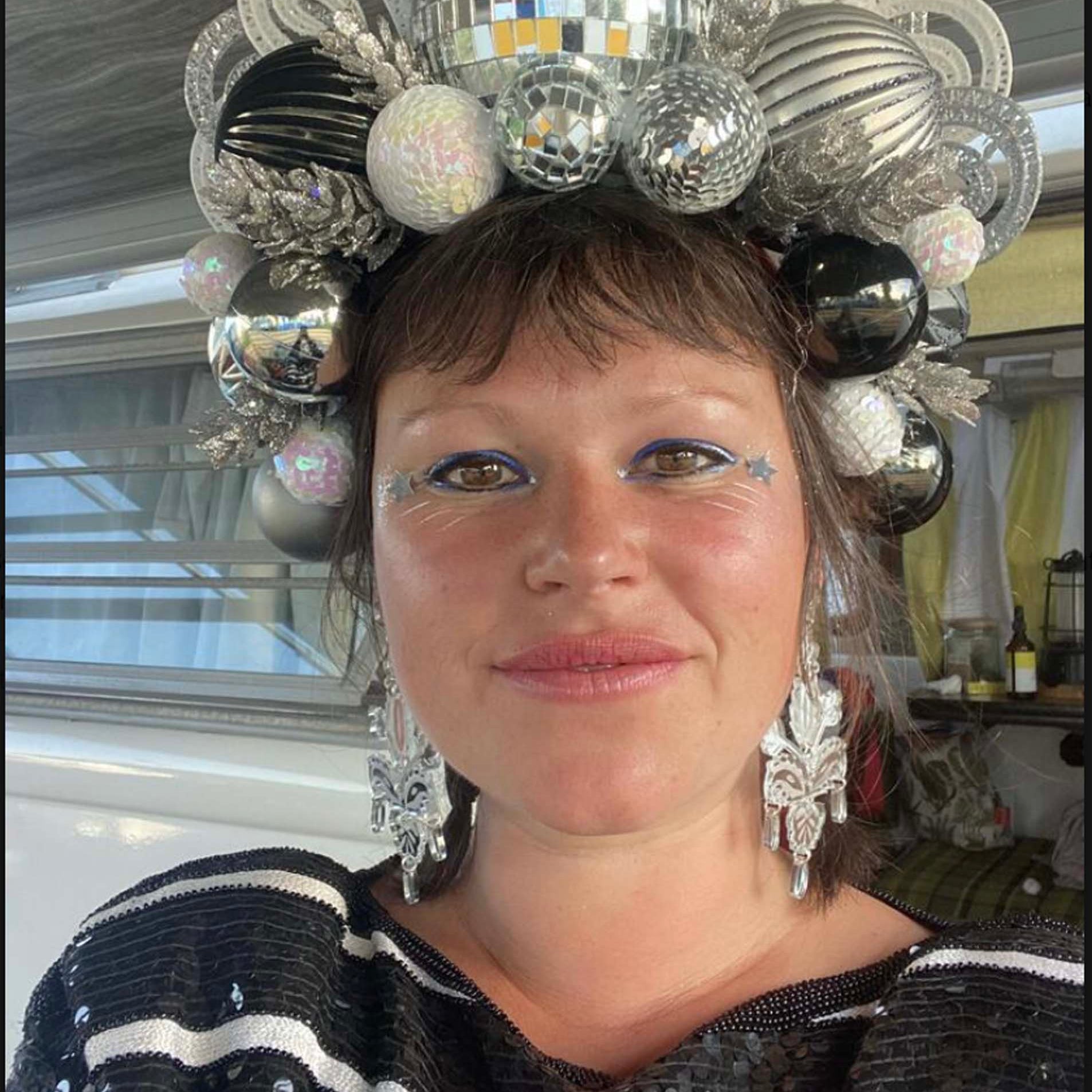 Rowan wears Festival Drop earrings in all silver