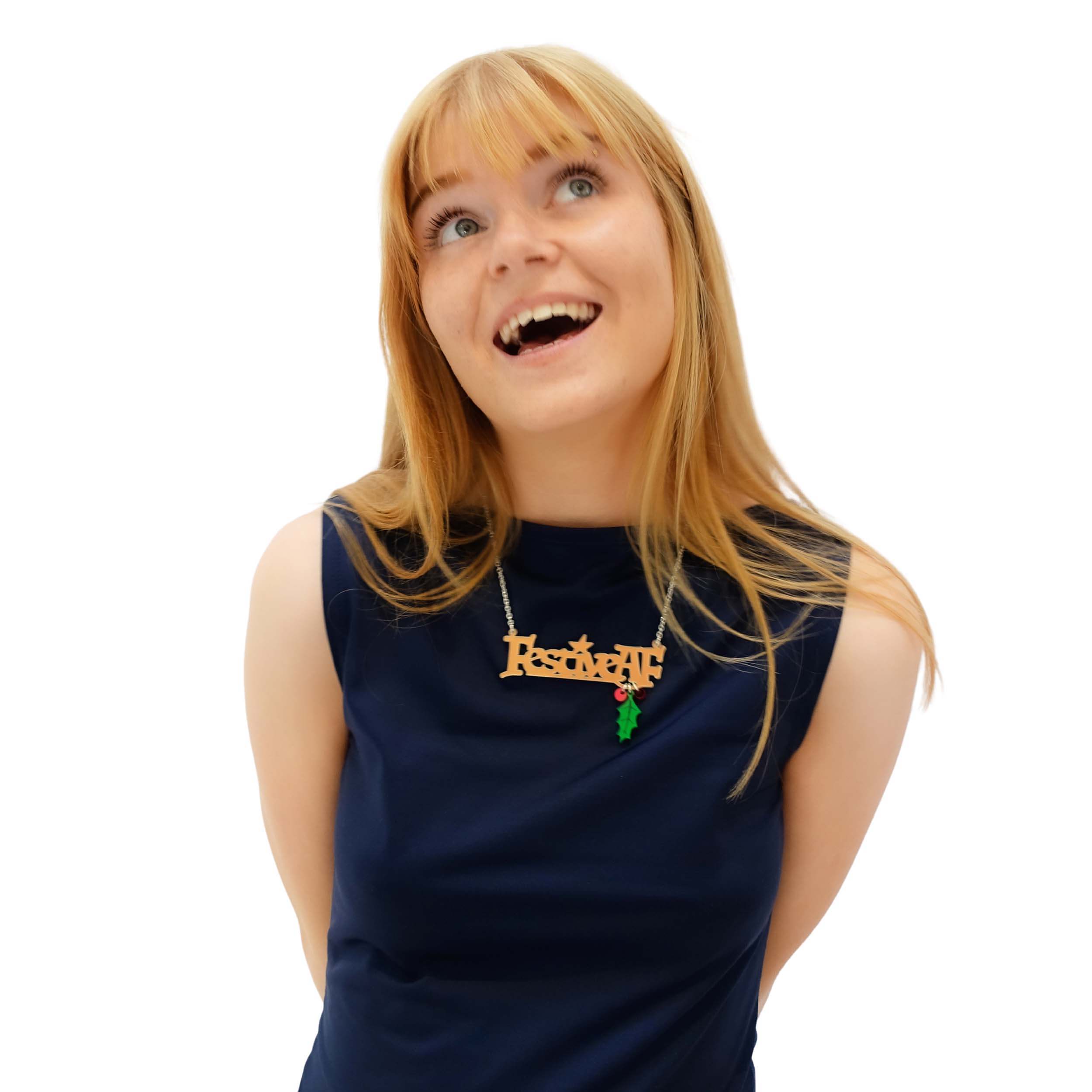 Eliza wears a Festive AF matte iridescent necklace with hanging holly leaf and berries.