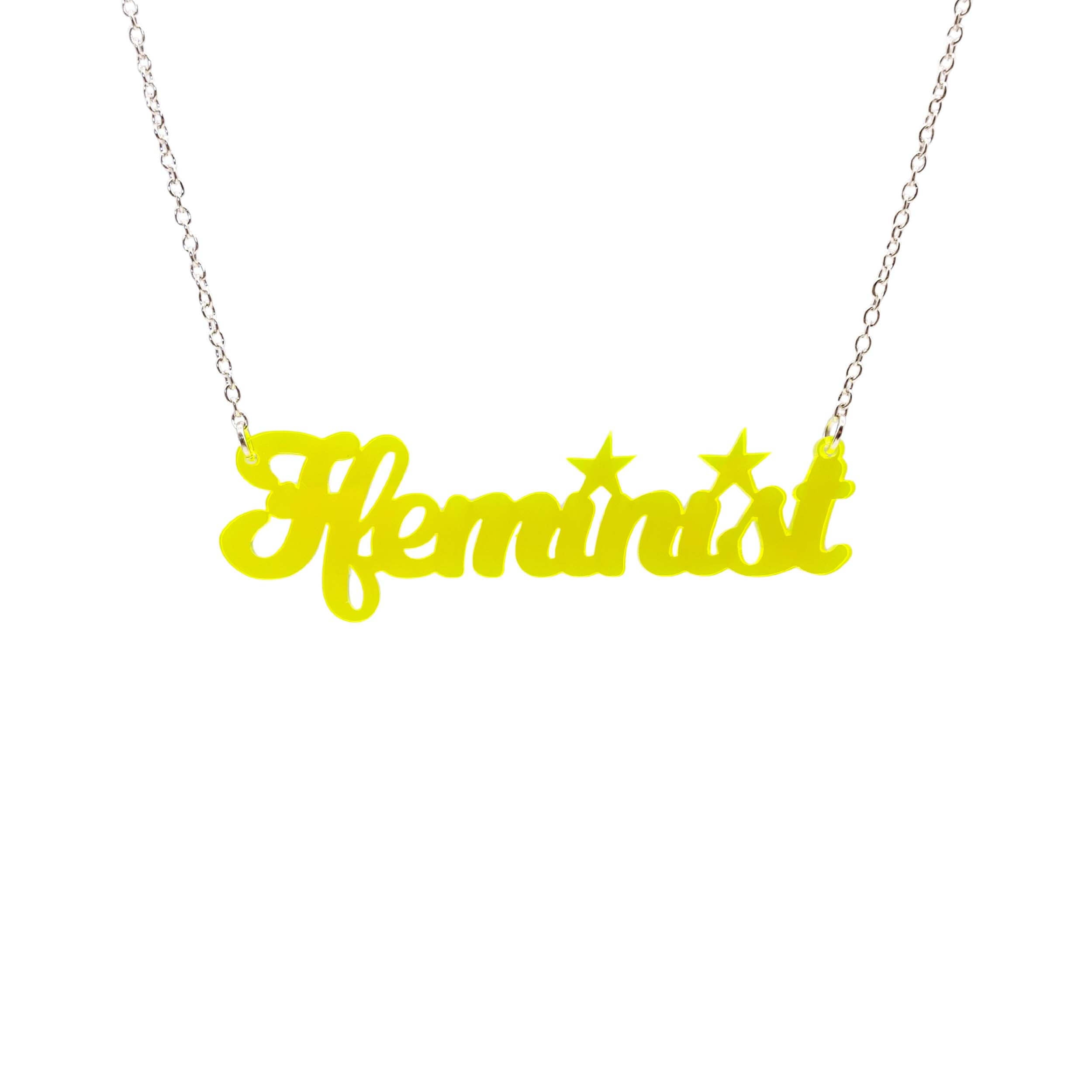 Welsh Ffeminist necklace in neon yellow, shown hanging against a white background.
