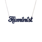 Welsh Ffeminist necklace in Welsh slate, shown hanging against a white background.