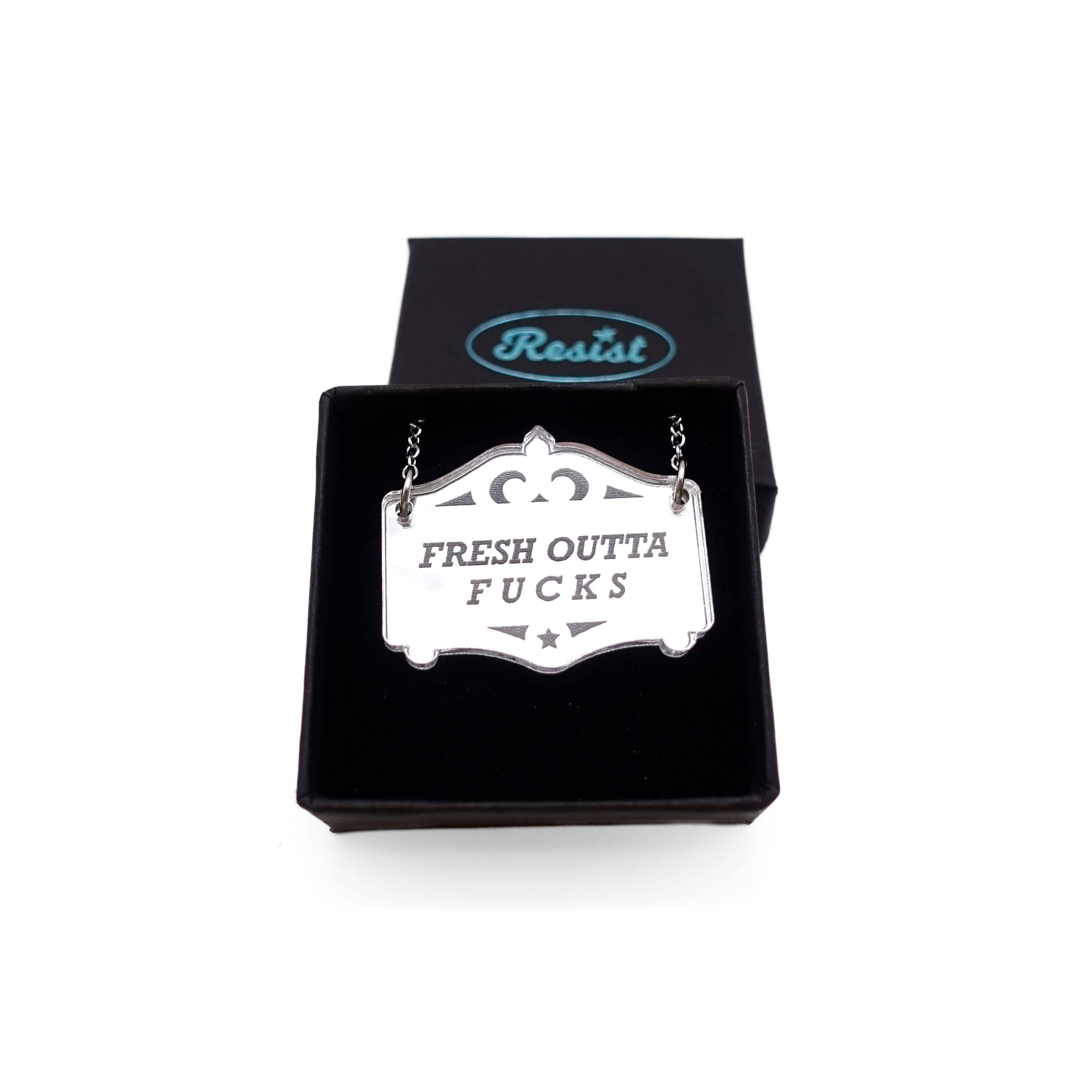 Fresh outta f*cks mirror cowboy necklace in silver, shown in a small Wear and Resist gift box.