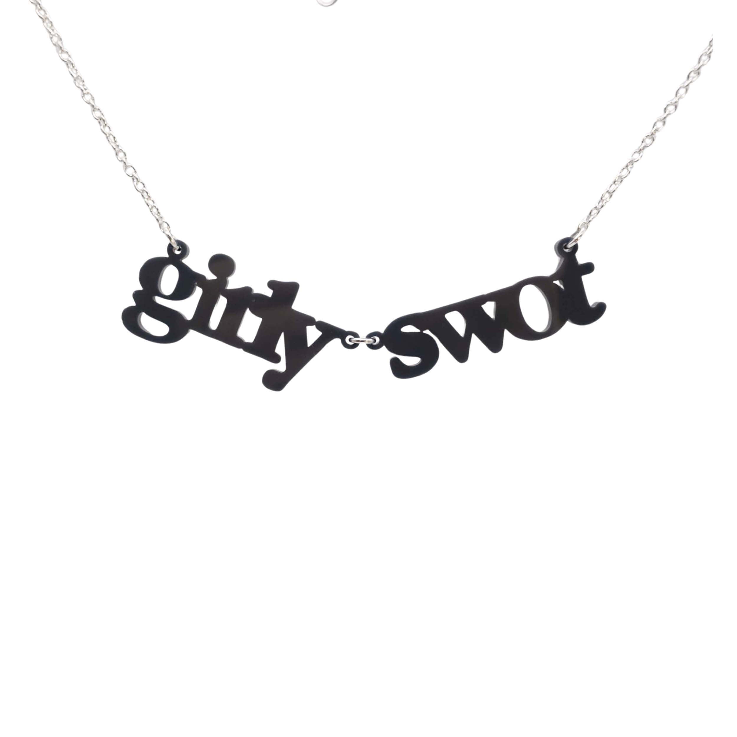 Girly Swot necklace in slate shown hanging against a white background.